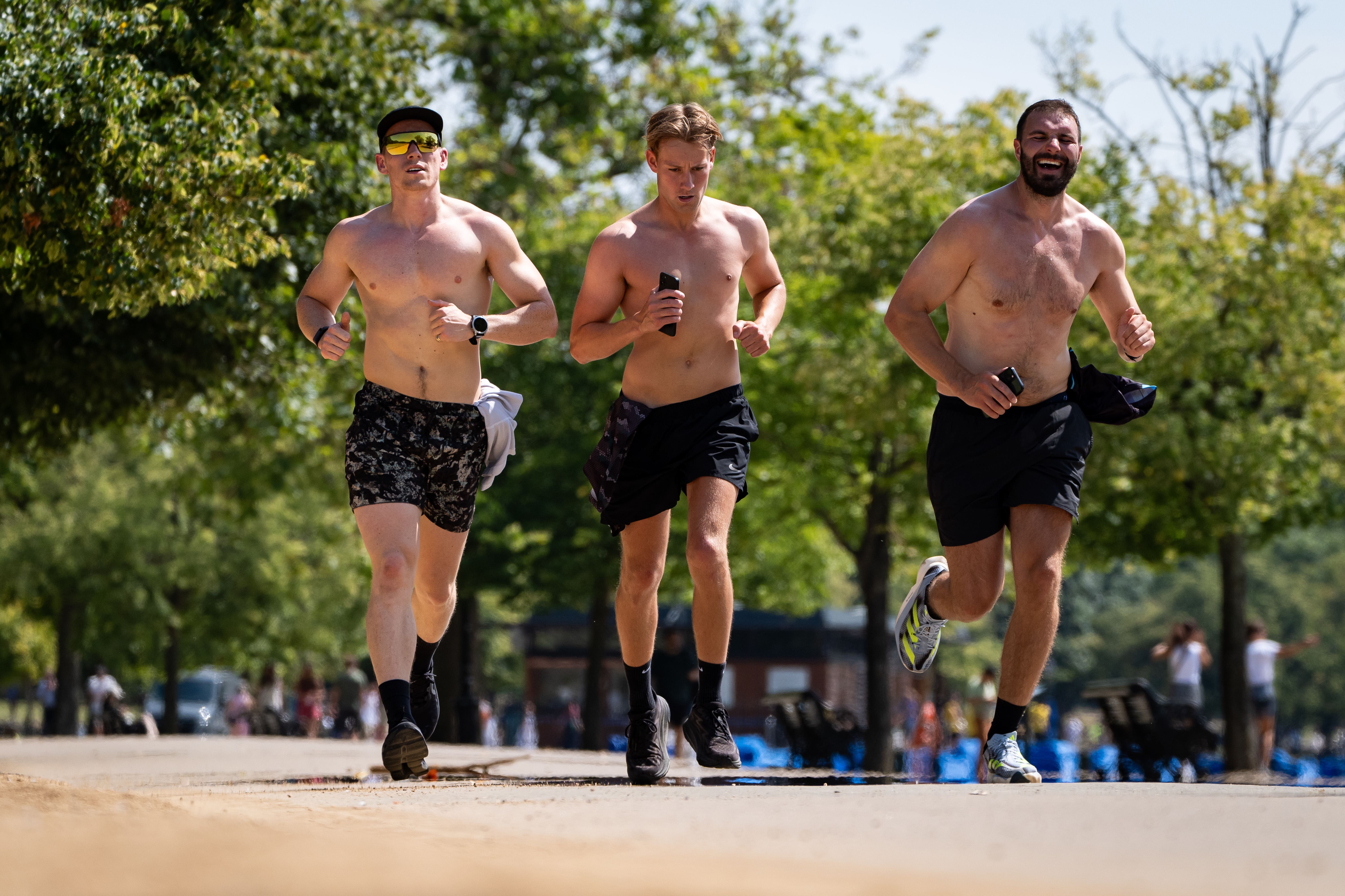 Joggers in Hyde Park, London, after Tuesday was provisionally the warmest day of the year so far (Aaron Chown/PA)