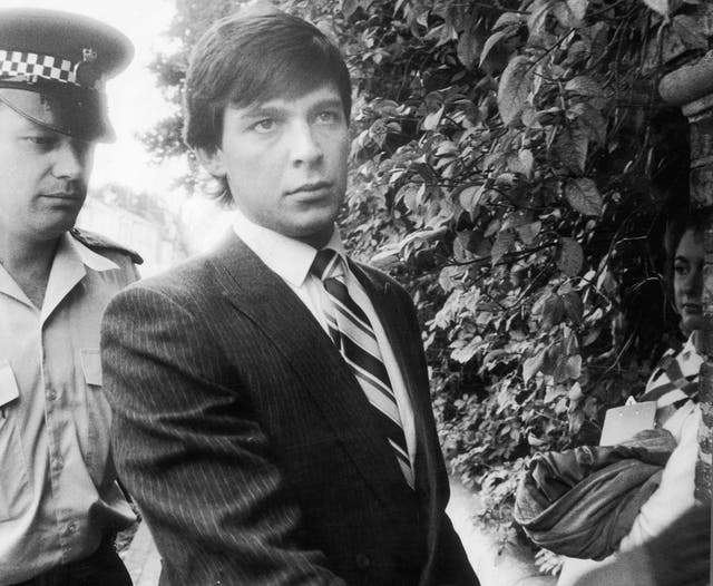 <p>Jeremy Bamber being lead to Chelmsford Crown Court at the start of his trial </p>