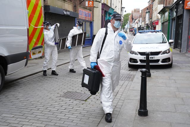 Police forensic investigators enter a disused building in Fore Bondgate, Bishop Auckland (Owen Humphreys/PA)