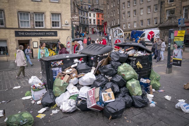 Scottish ministers are being urged to hold emergency talks after three trade unions announced co-ordinated strike action by council waste and cleansing workers (Jane Balow/PA)