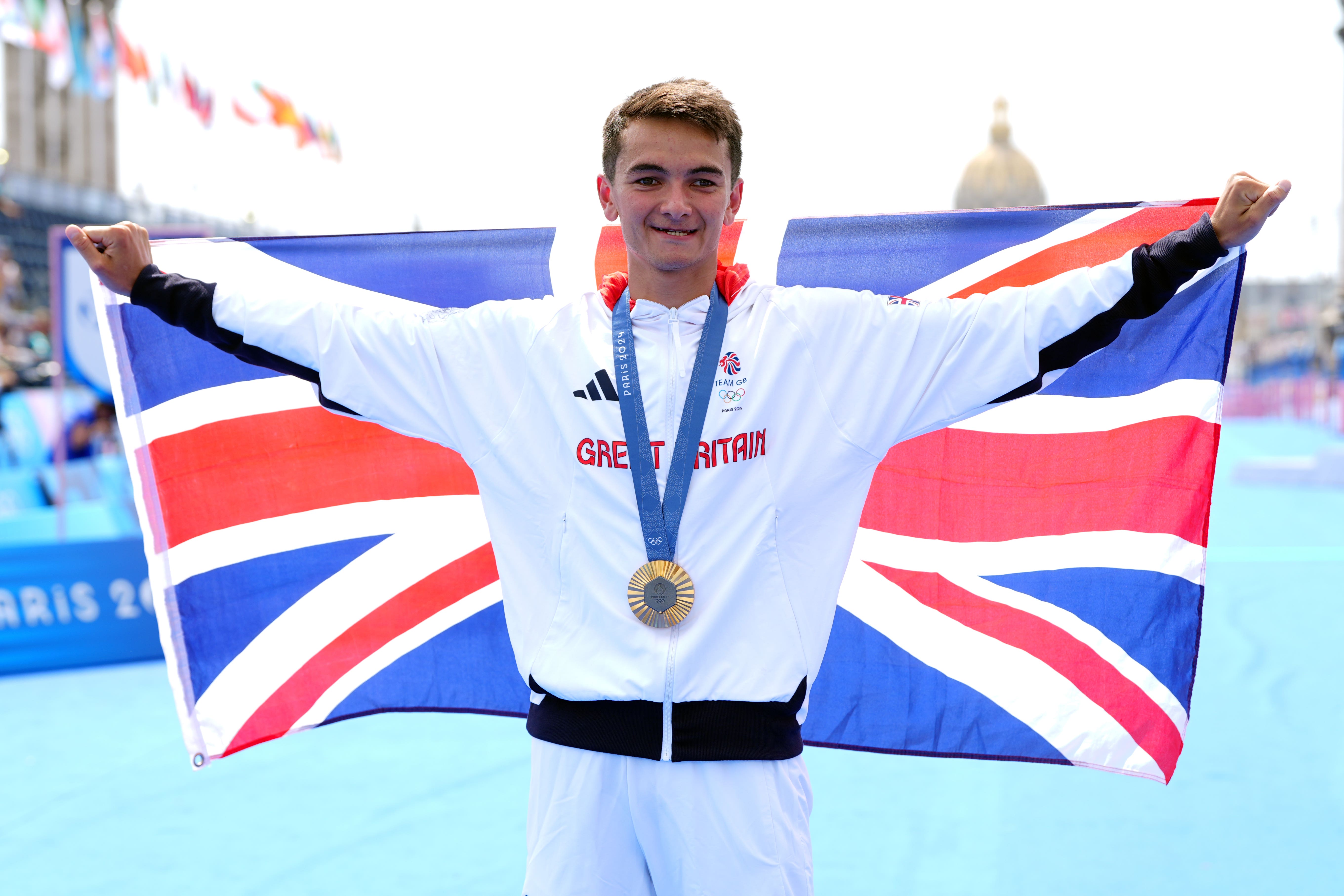 Great Britain’s Alex Yee with his gold medal following the men’s individual triathlon at the Pont Alexandre III on the fifth day of the 2024 Paris Olympic Games in France (David Davies/PA)