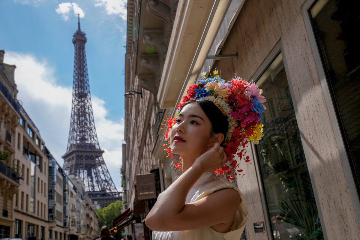 AP PHOTOS: With the Paris Games as their canvas, people are every aspect of the City of Lights