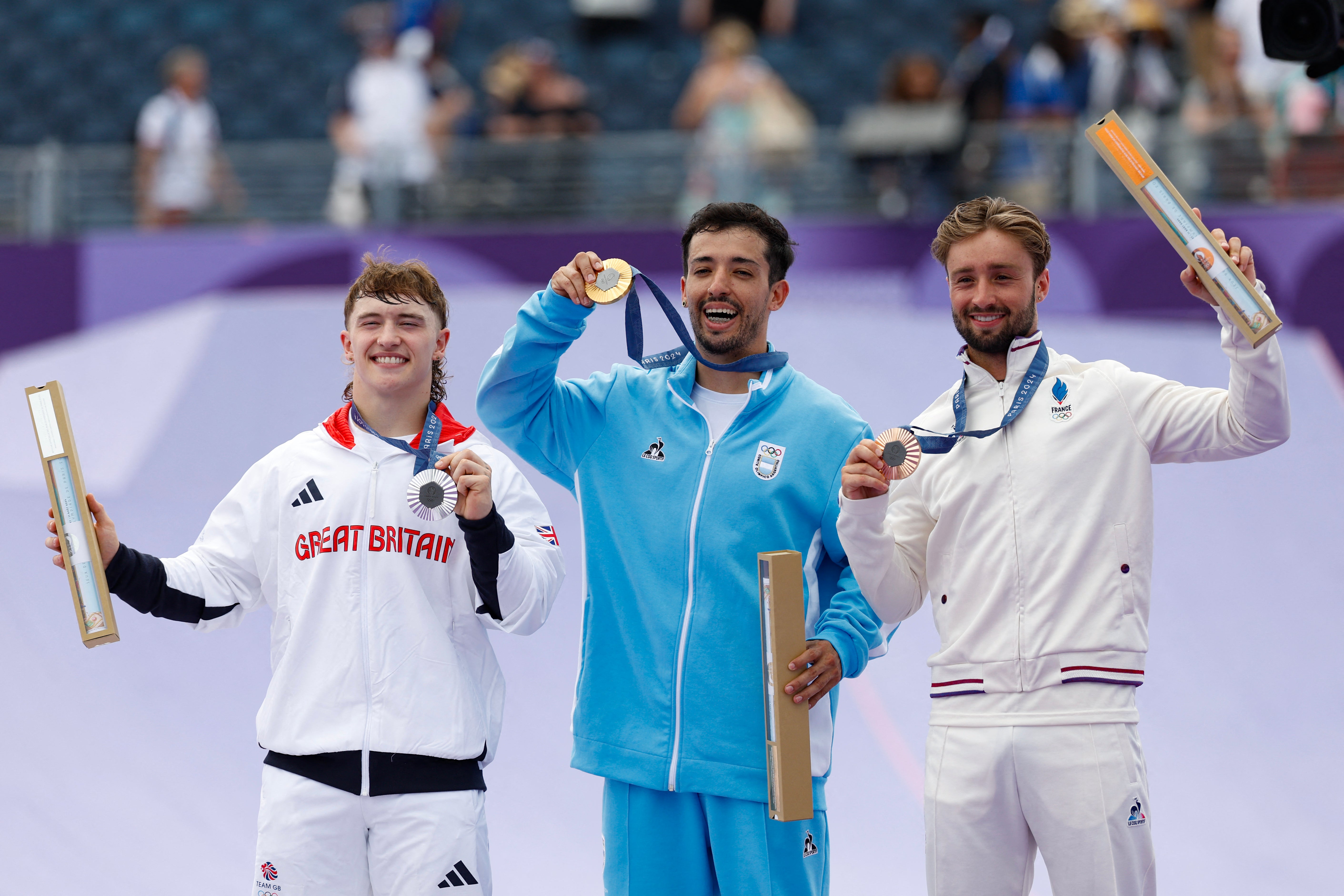 Silver medallist Britain’s Kieran Darren David Reilly, gold medallist Argentina’s Jose Torres Gil, and bronze medallist France’s Anthony Jeanjean pose with their medals