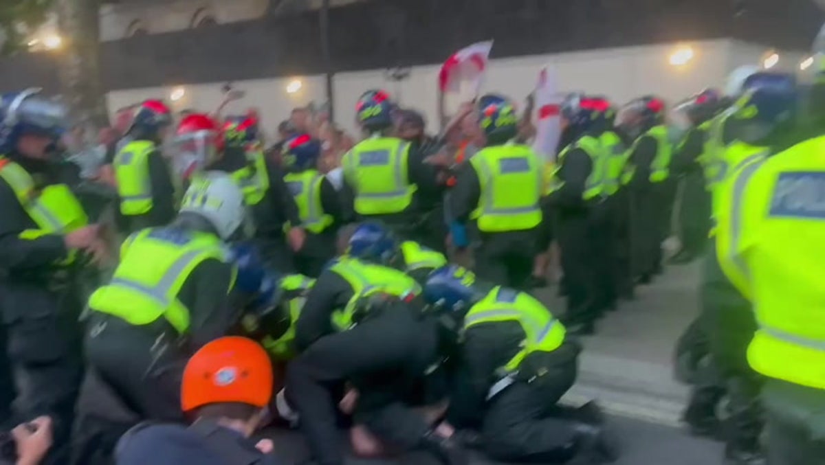 Protesters waving St George flags clash with police at Downing Street over Southport stabbings