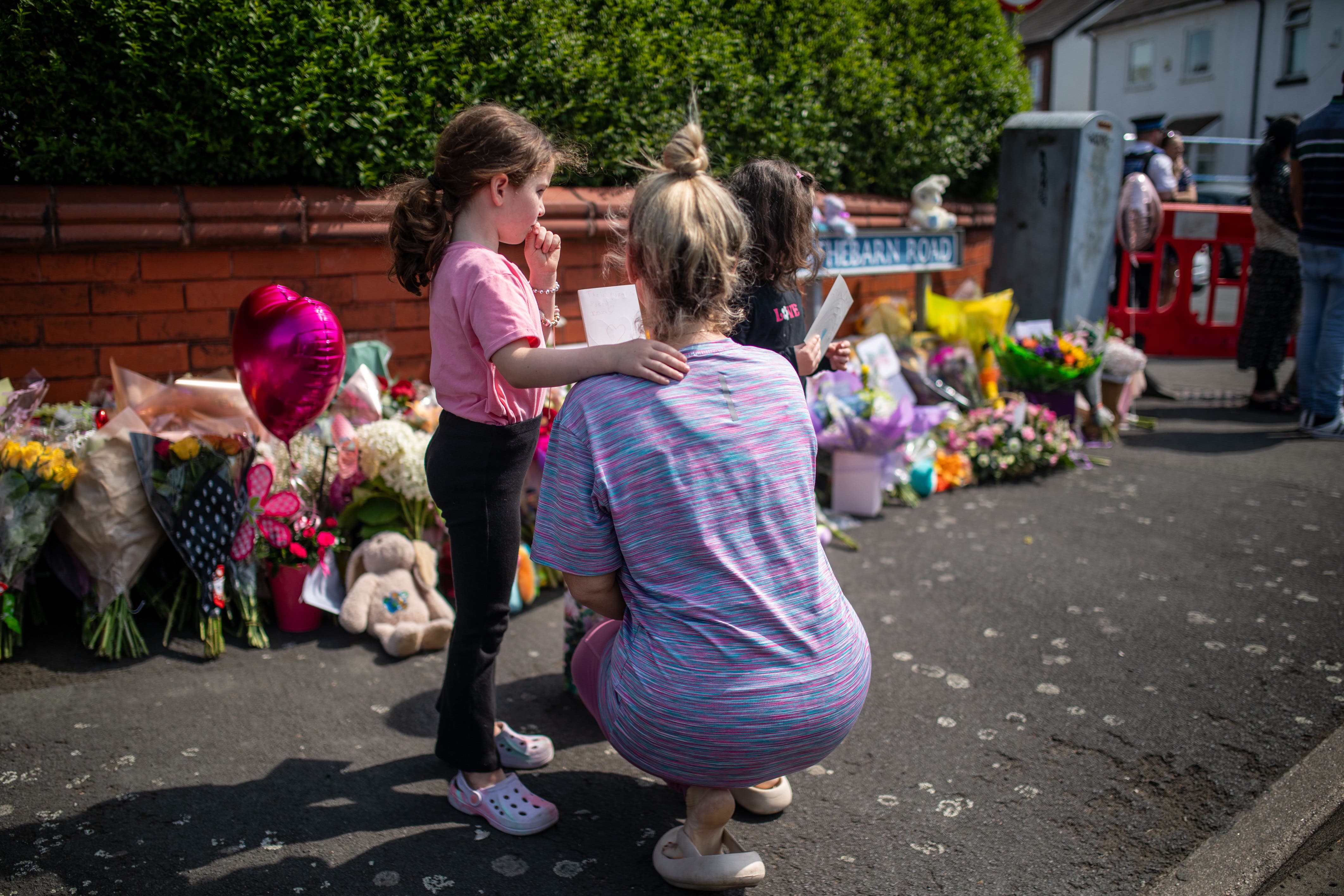 People lay flowers near the scene in Hart Street, Southport (James Speakman/PA)