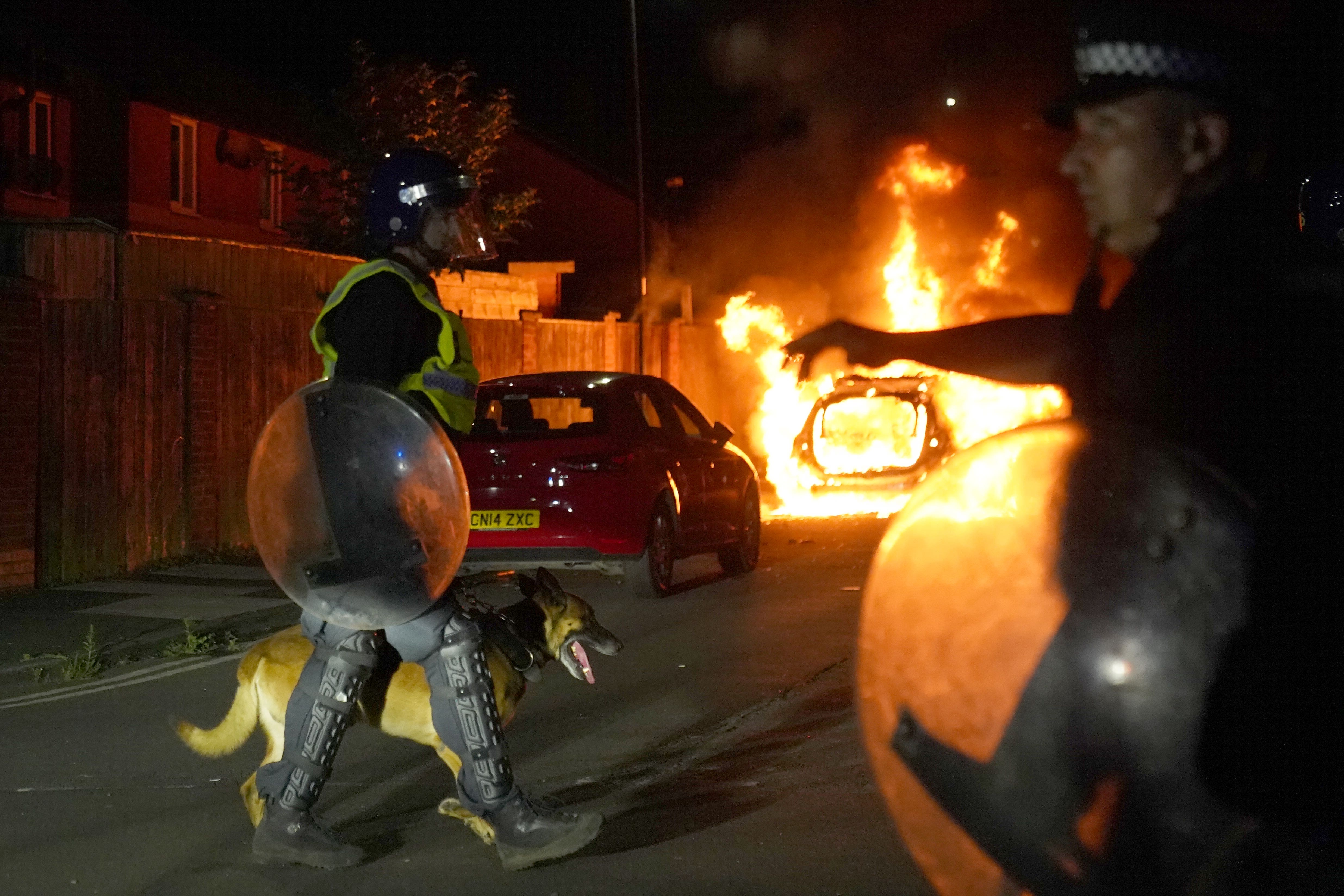 A police car burns as officers are deployed on the streets of Hartlepool following violence on Wednesday