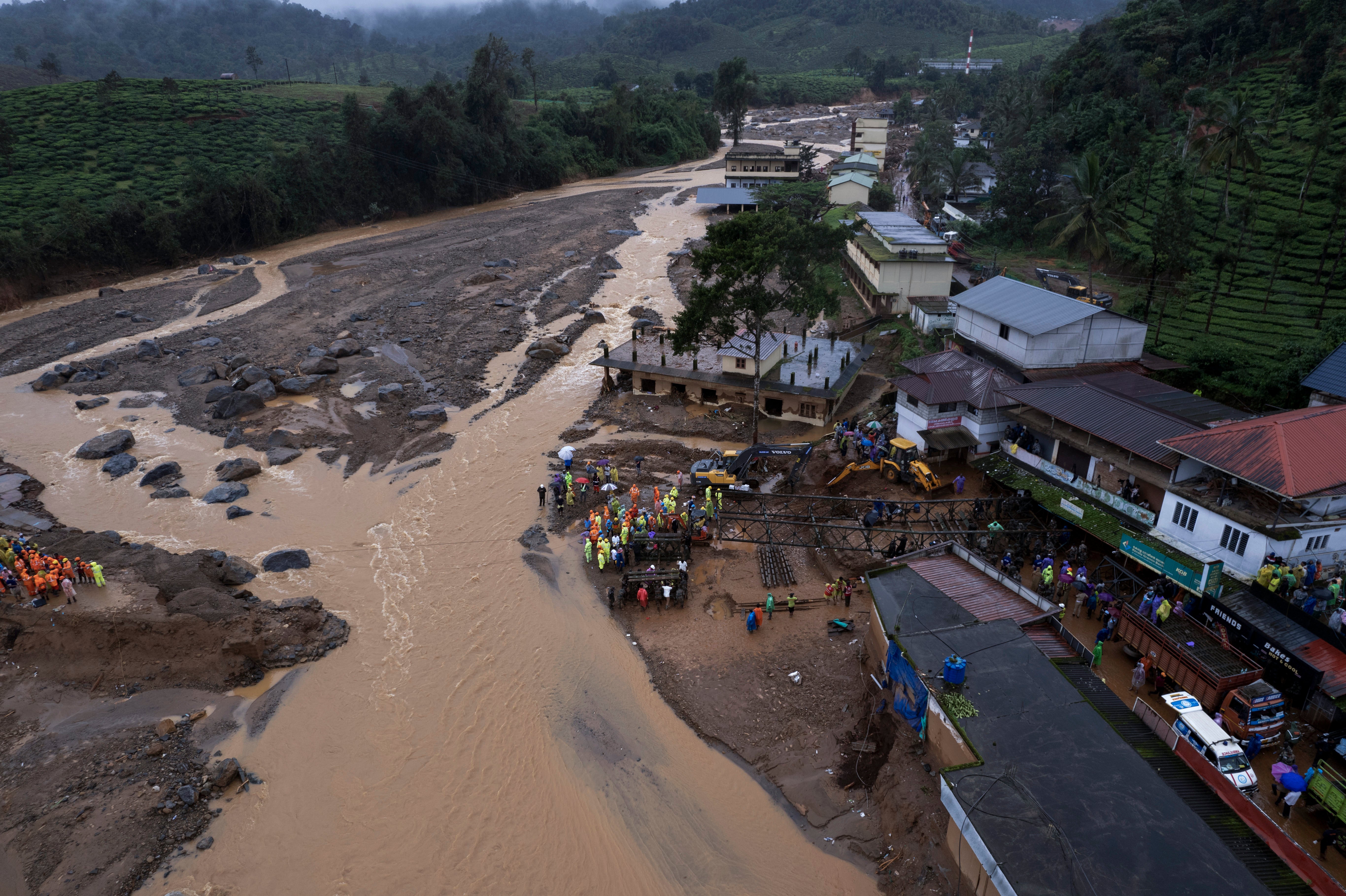 Indian soldiers set up a prefabricated bridge for rescue operations following Tuesday’s landslides at Chooralmala, Wayanad district