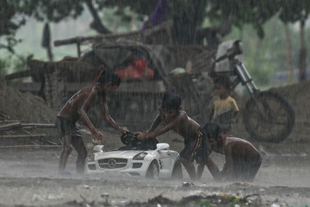 <p>File: Children during heavy rainfall in New Delhi on 9 July 2024</p>