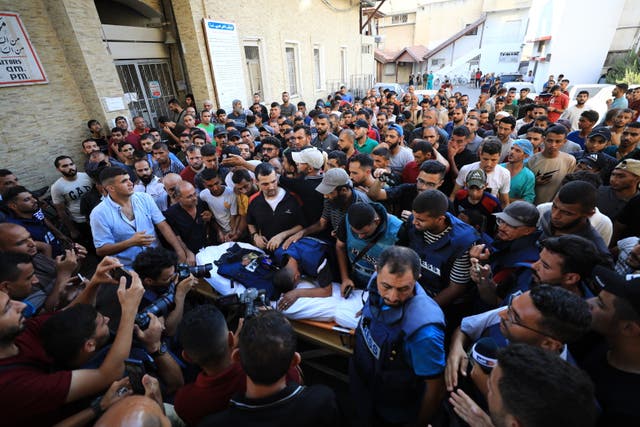 <p>Palestinians attend the funeral ceremony of the journalists killed in the Israeli attack in Gaza</p>