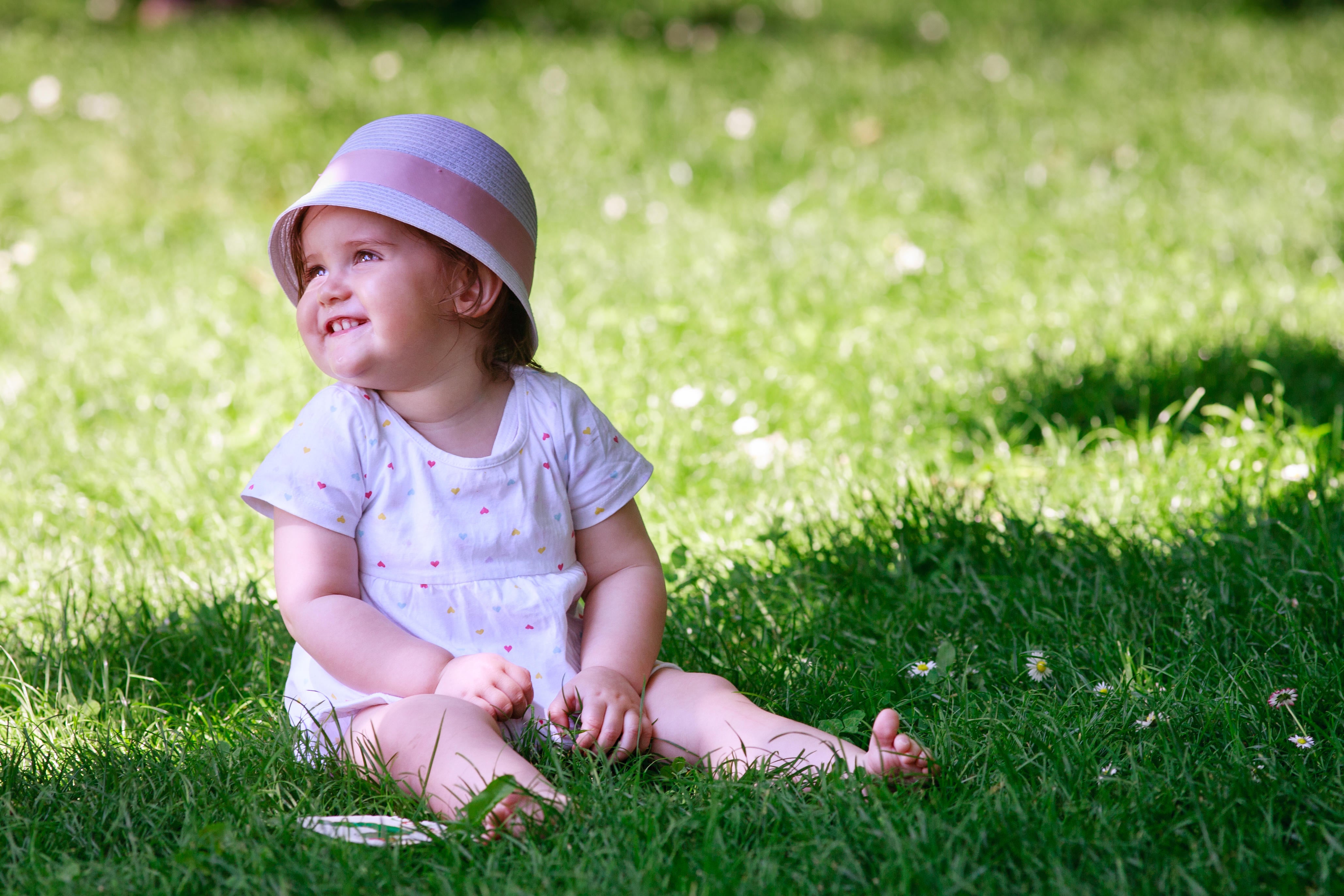 14 week old toddler sitting in the shade