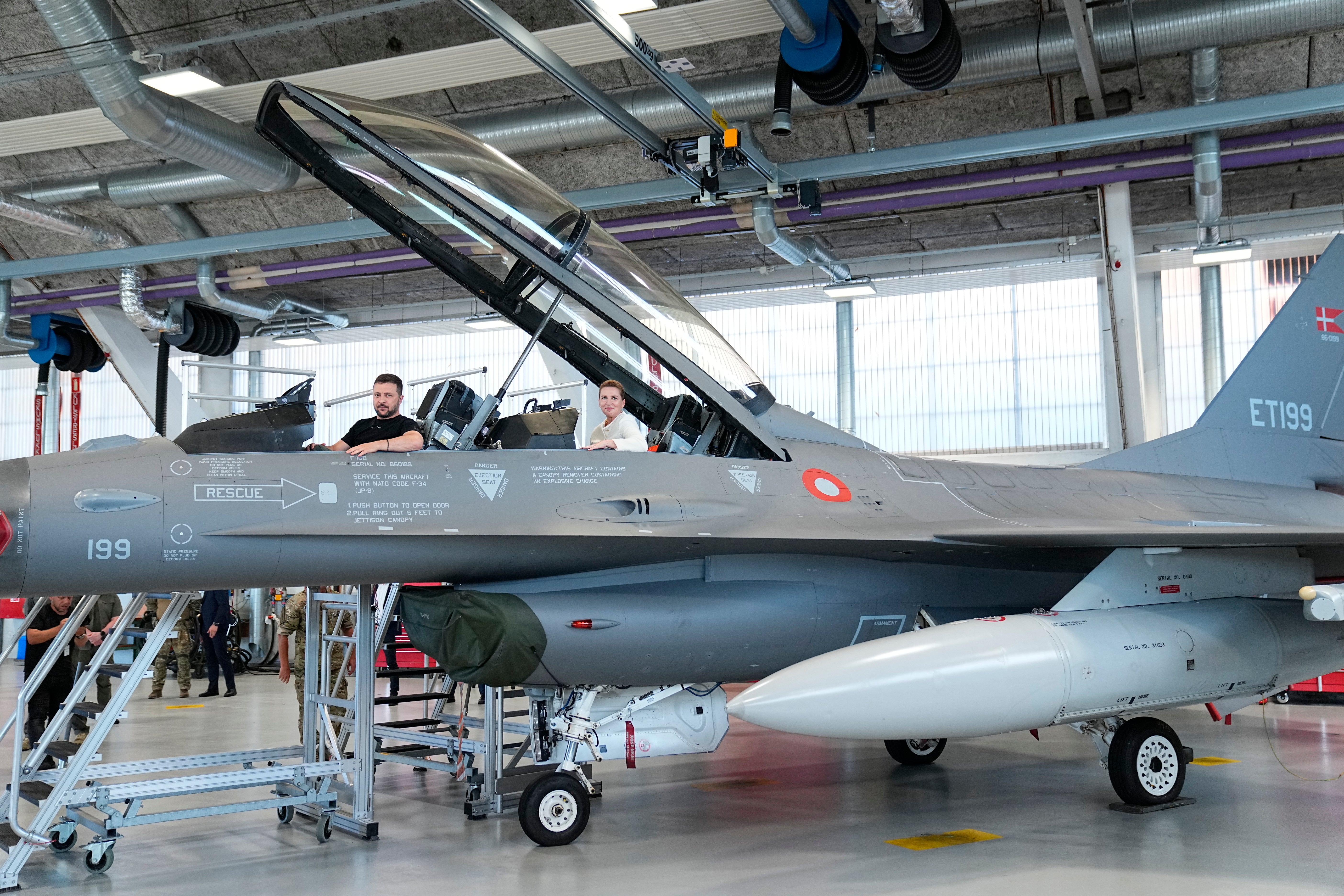 Ukrainian president Volodymyr Zelensky and Denmark’s prime minister Mette Frederiksen sit in a F-16 in August last year