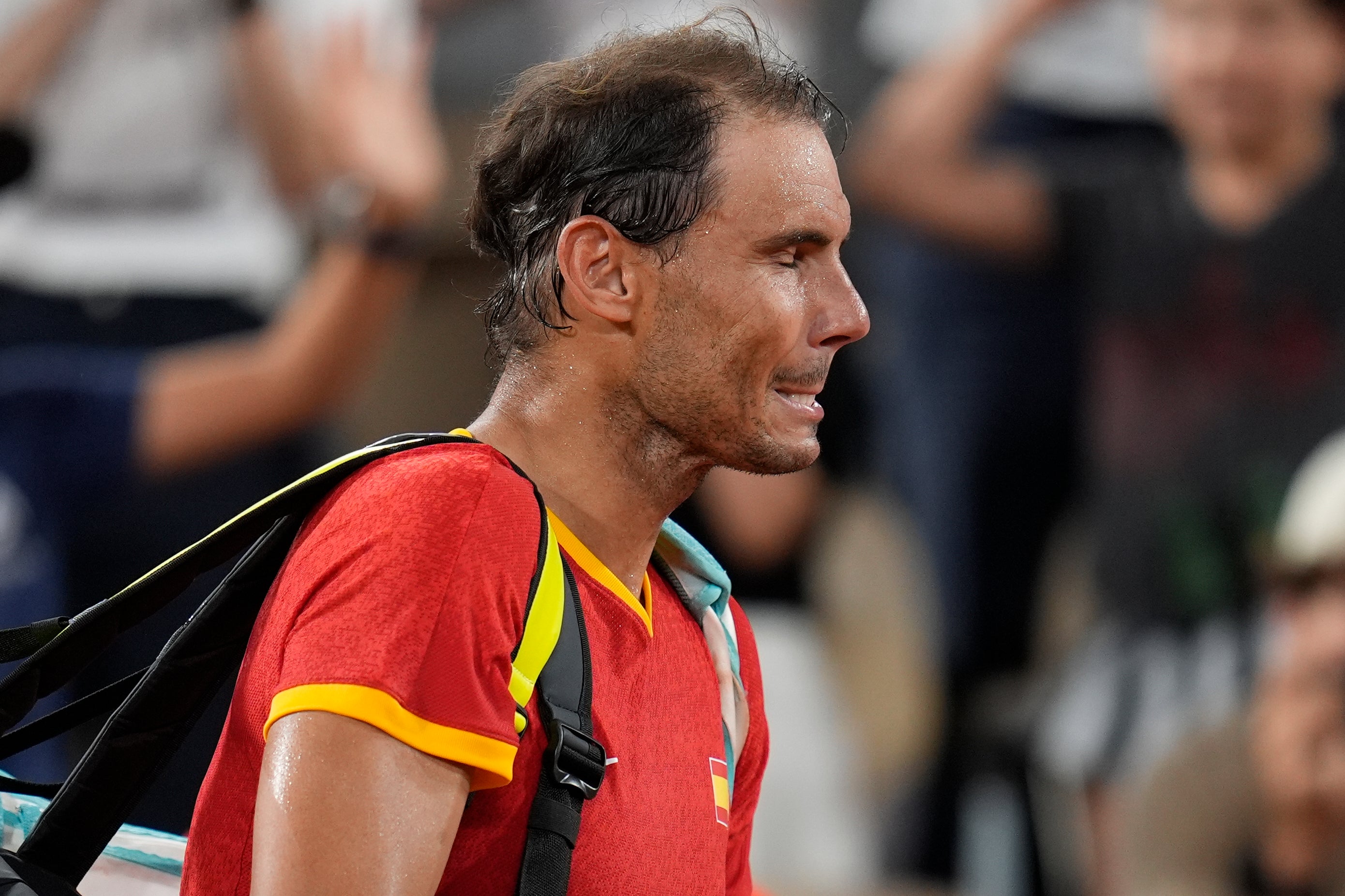 Rafael Nadal reacts after losing with his teammate Carlos Alcaraz