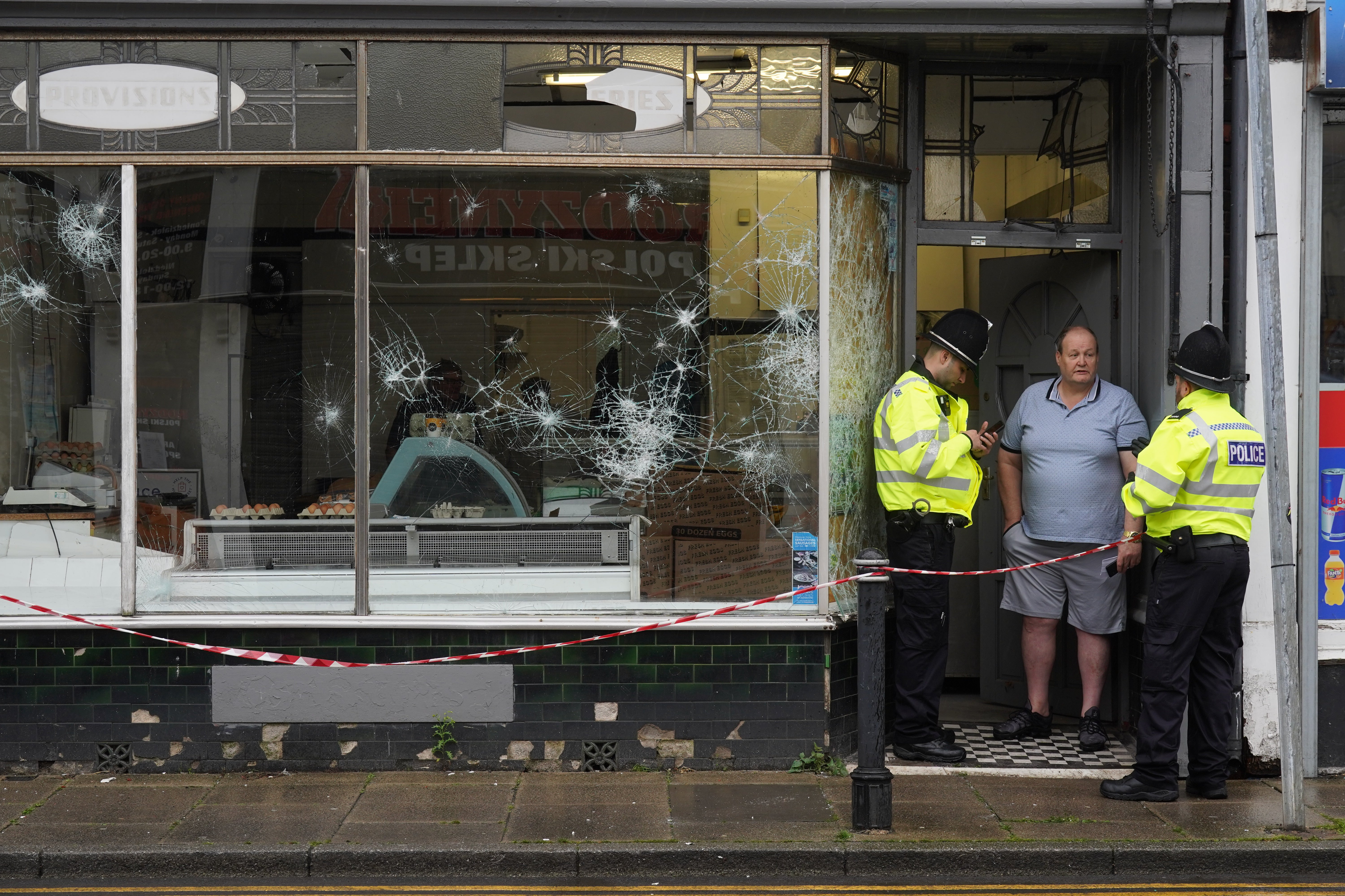 Police officers outside a damaged butchers shop on Murray Street in Hartlepool