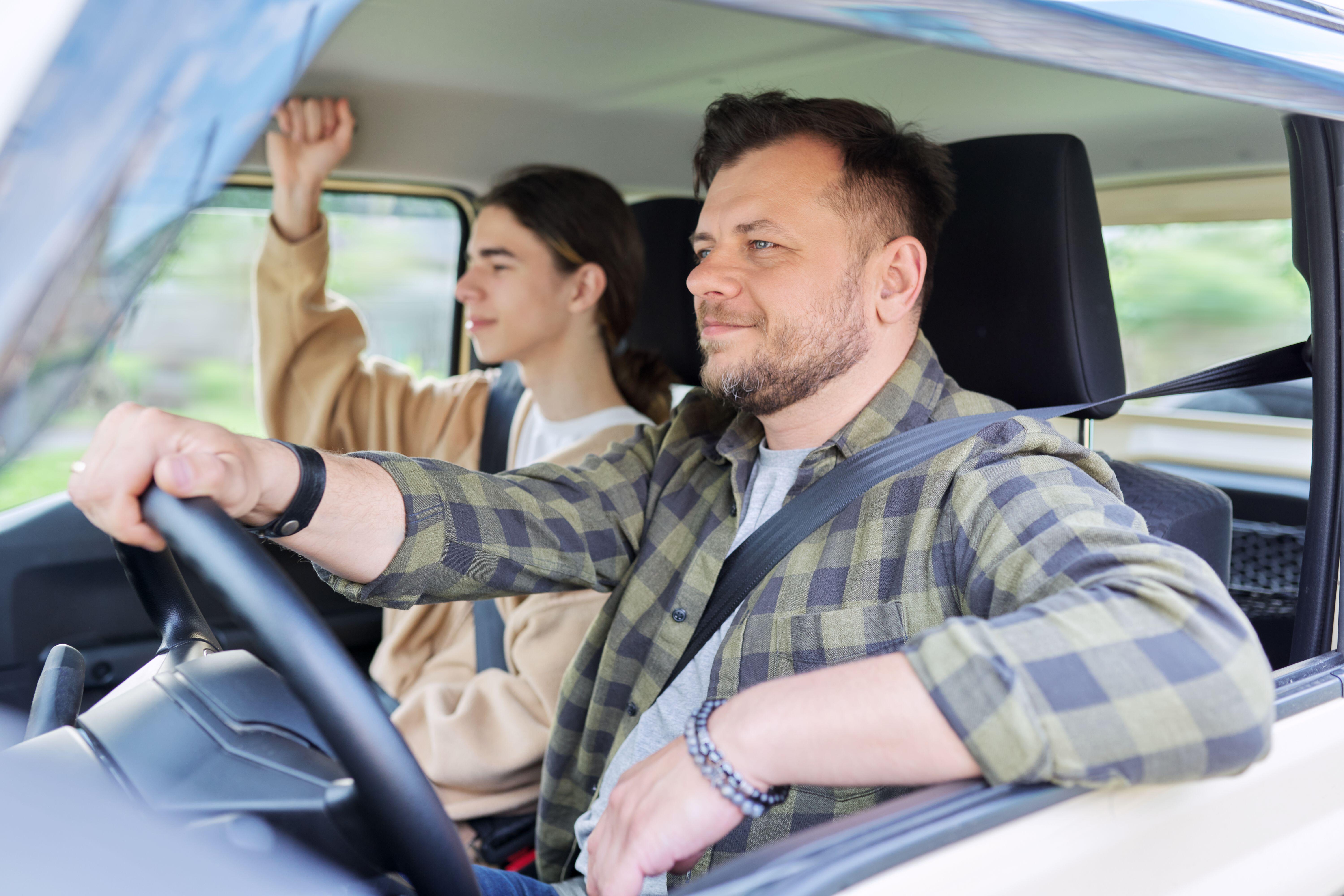 Try talking to them about it while you are driving (Alamy/PA)