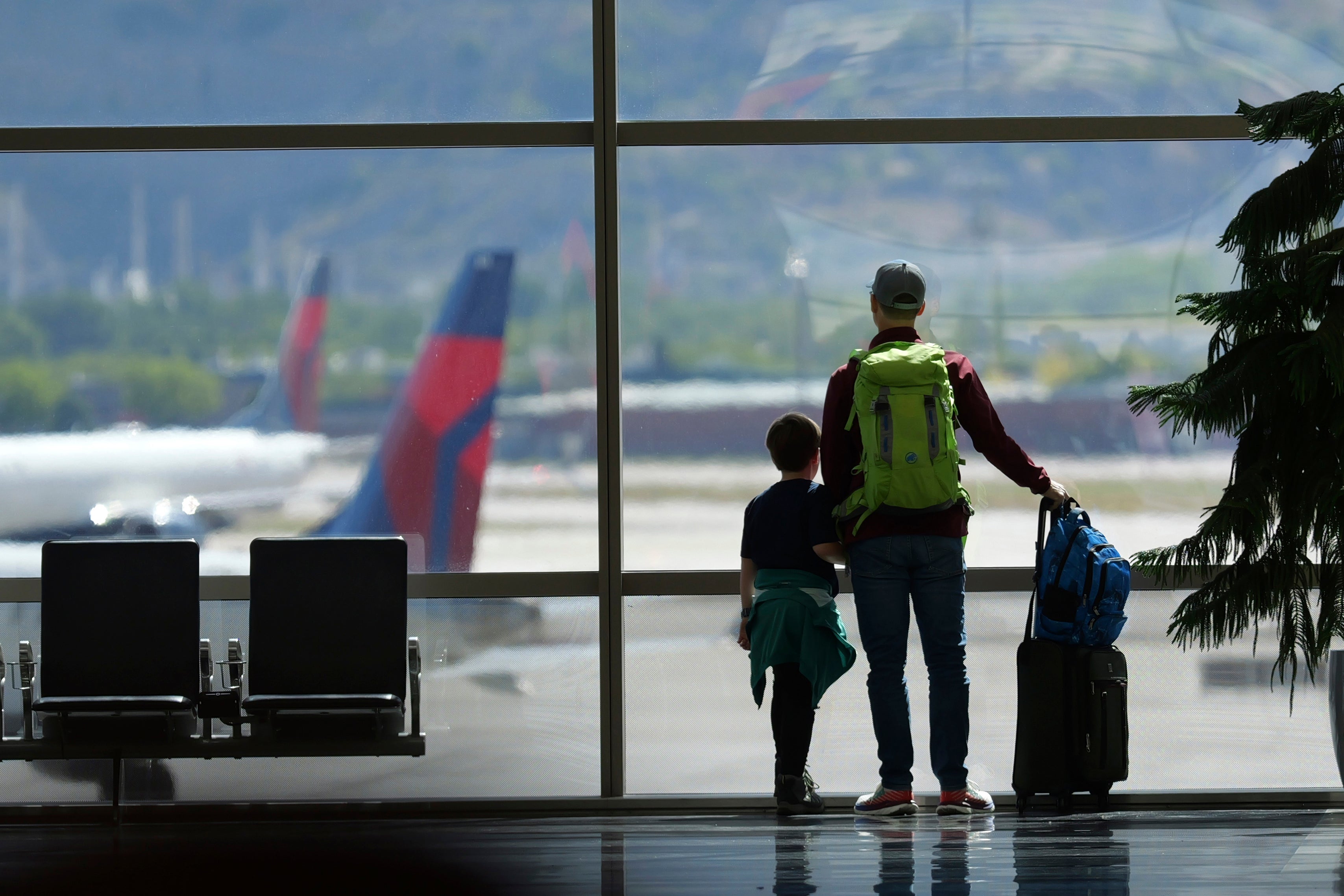 Travelers pass through Salt Lake City International Airport on May 24, 2024, in Salt Lake City