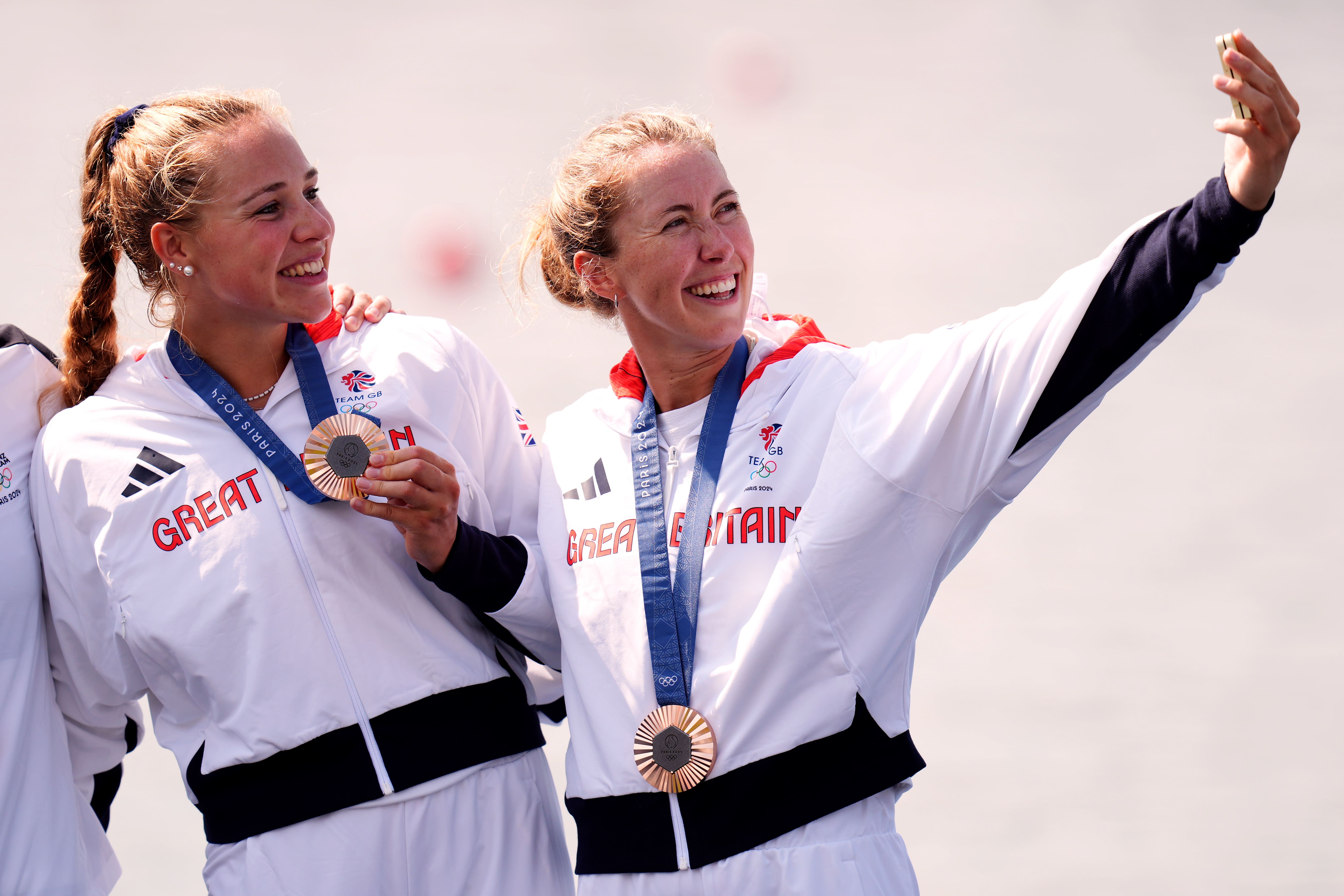 Team GB rowers Mathilda Hodgkins Byrne and Becky Wilde take a selfie after receiving their bronze medals at the Paris Olympics (John Walton/PA)