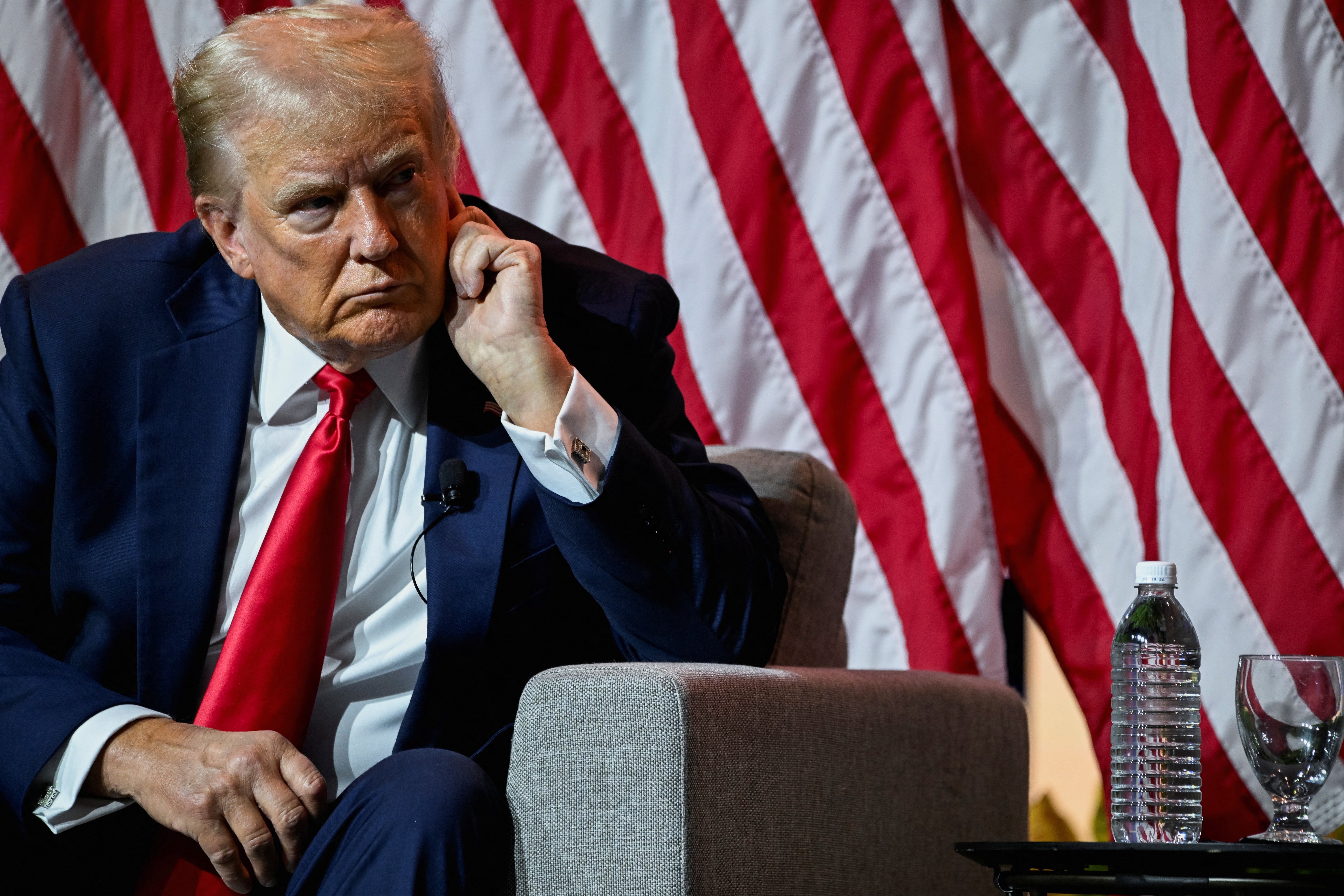 Republican presidential nominee and Donald Trump looks on as he speaks on a panel of the National Association of Black Journalists convention in Chicago