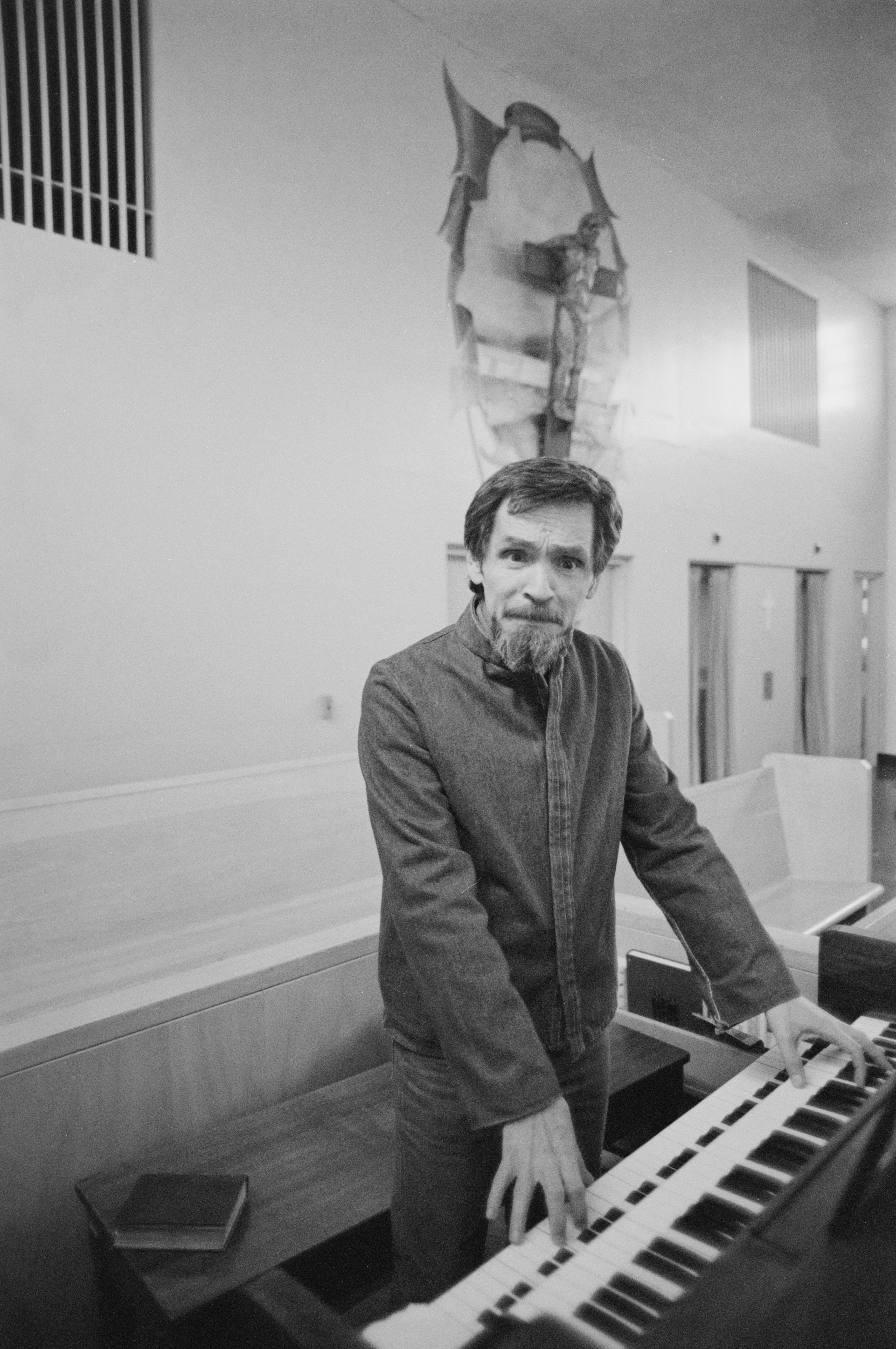 Manson playing the piano inside the chapel at the California Medical Facility, Vacaville, circa 1984