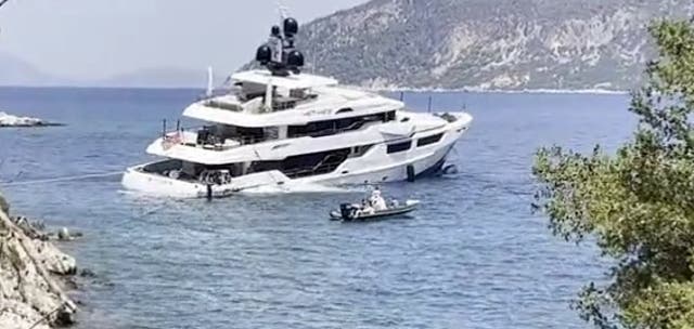 <p>A luxury 150ft megayacht sinking in Greece earlier this month </p>