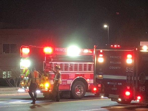 Prince William County firefighters in Sterling, Virginia, assist local fire and rescue officials after a food processing plant suffered an ammonia leak that left 33 workers hospitalized on July 31