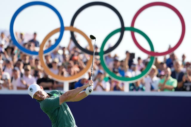 <p>Rory McIlroy hits his tee shot on the first hole at Le Golf National</p>