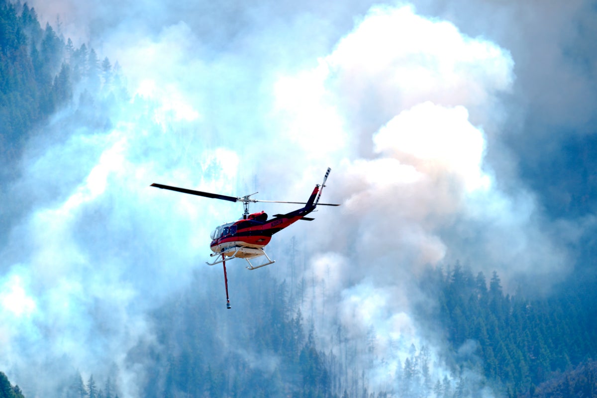 Wildfires encroach on homes near Denver as heat hinders fight