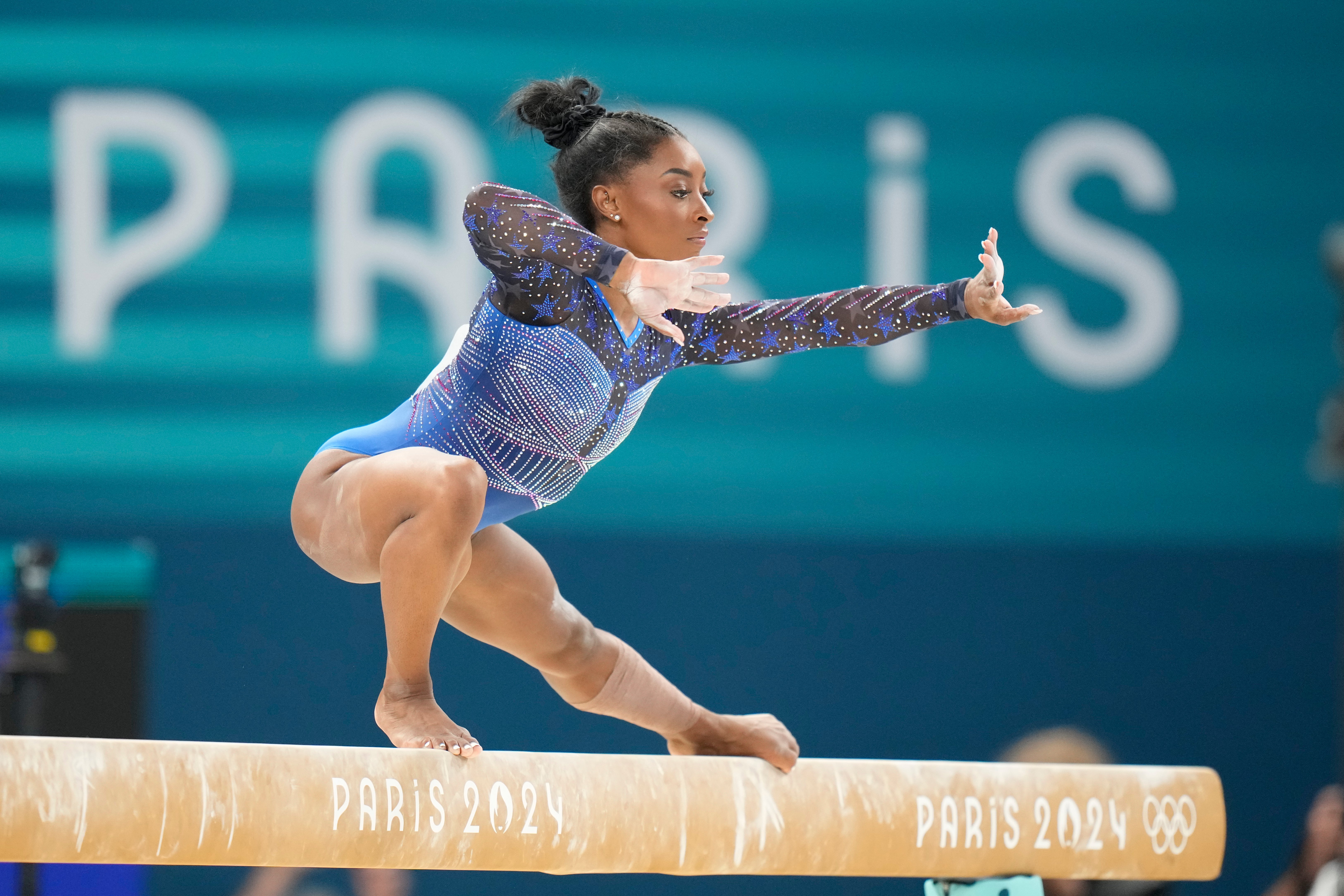 Simone Biles, of the United States, performs on the balance beam