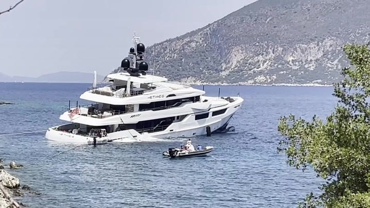 <p>Moment luxury 150ft megayacht starts sinking off Greek island with five tourists on board.</p>