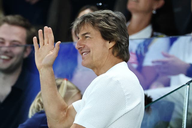 <p>Tom Cruise waves during the Artistic Gymnastics Women's Qualification on day two of the Olympic Games Paris 2024</p>