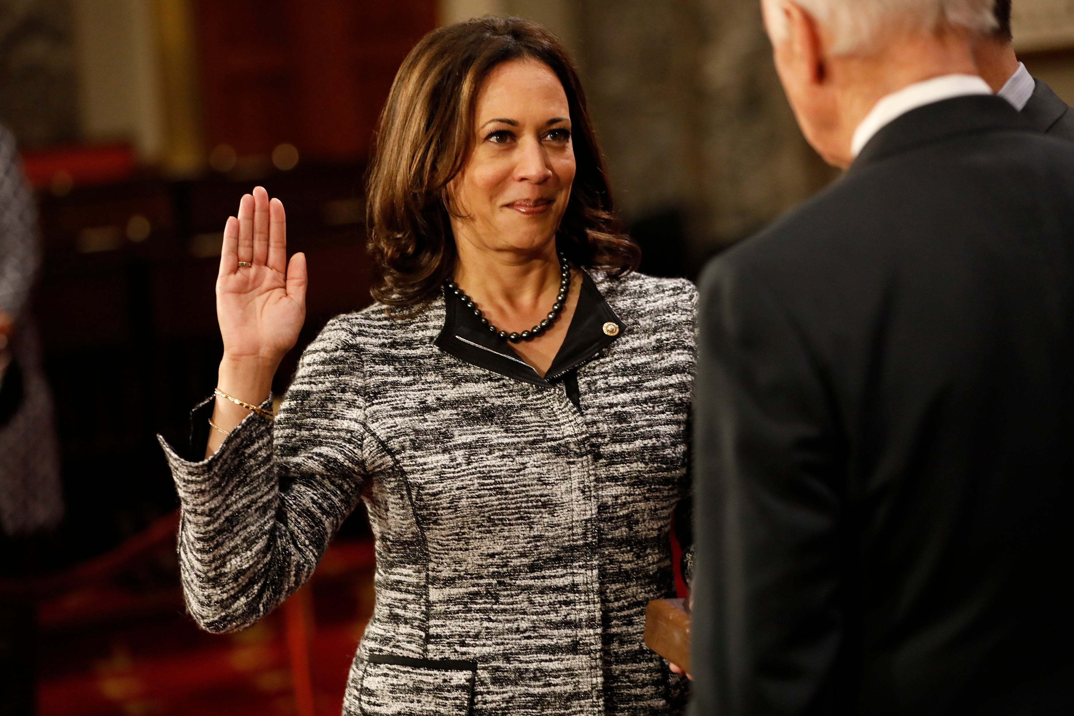 U.S. Sen. Kamala Harris (D-CA) participates in a reenacted swearing-in with U.S. Vice President Joe Biden in the Old Senate Chamber at the U.S. Capitol January 3, 2017 in Washington, DC