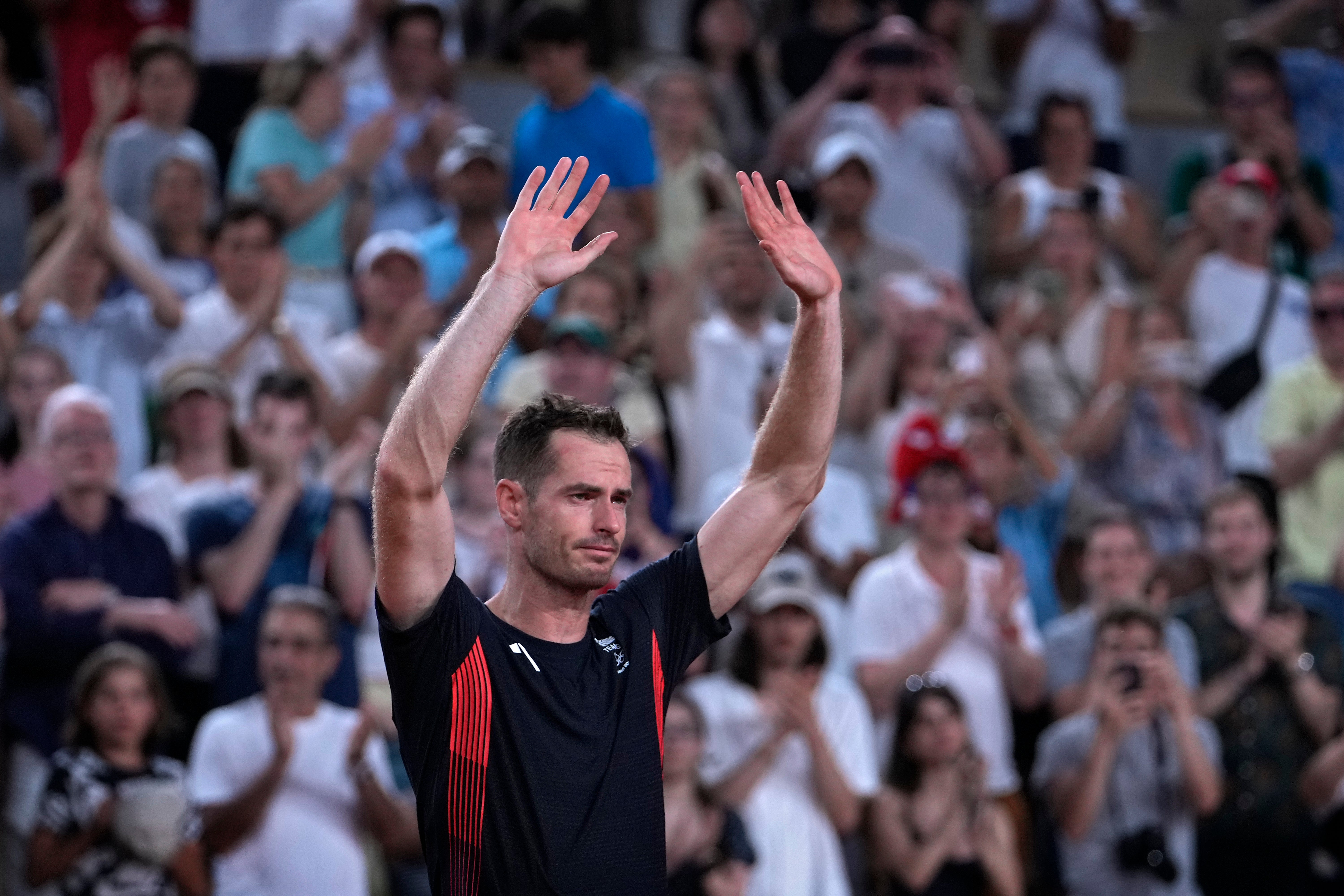 An emotional Andy Murray waves to Court Suzanne Lenglen (Andy Wong/AP)