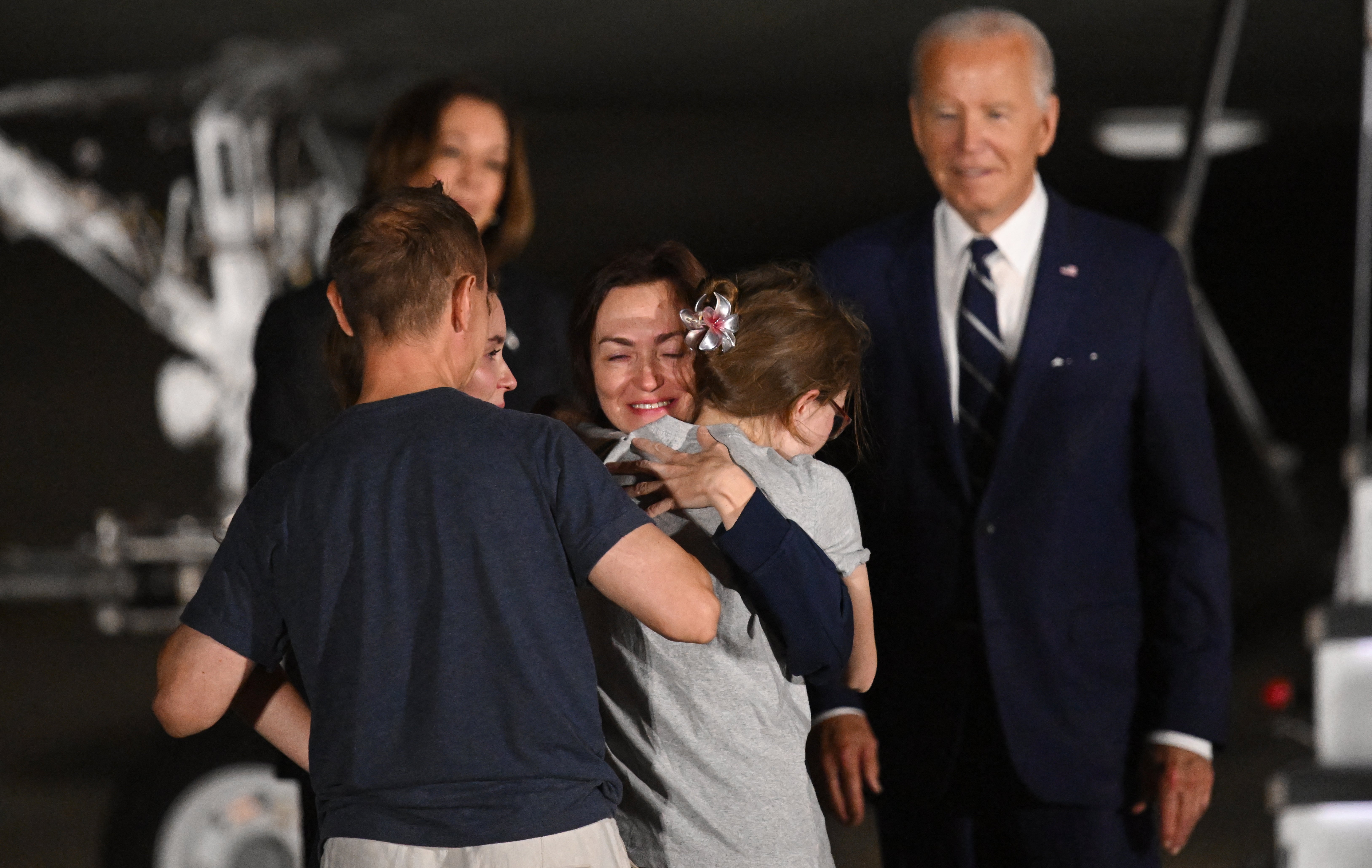 Former prisoner held by Russia US-Russian journalist Alsu Kurmasheva embraces her family as she arrives