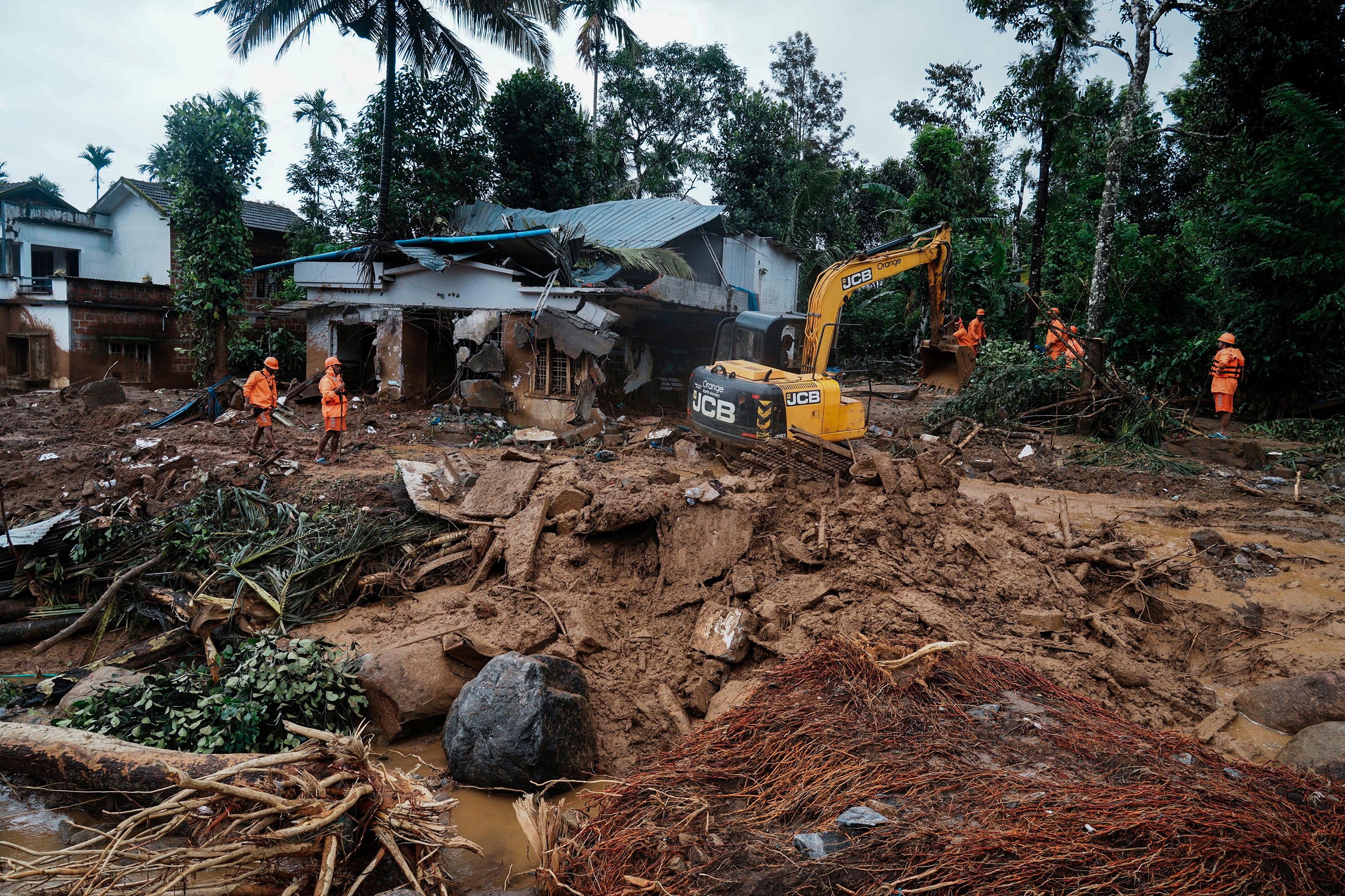 Rescuers search through mud and debris for a third day after landslides set off by torrential rains in Wayanad district, Kerala