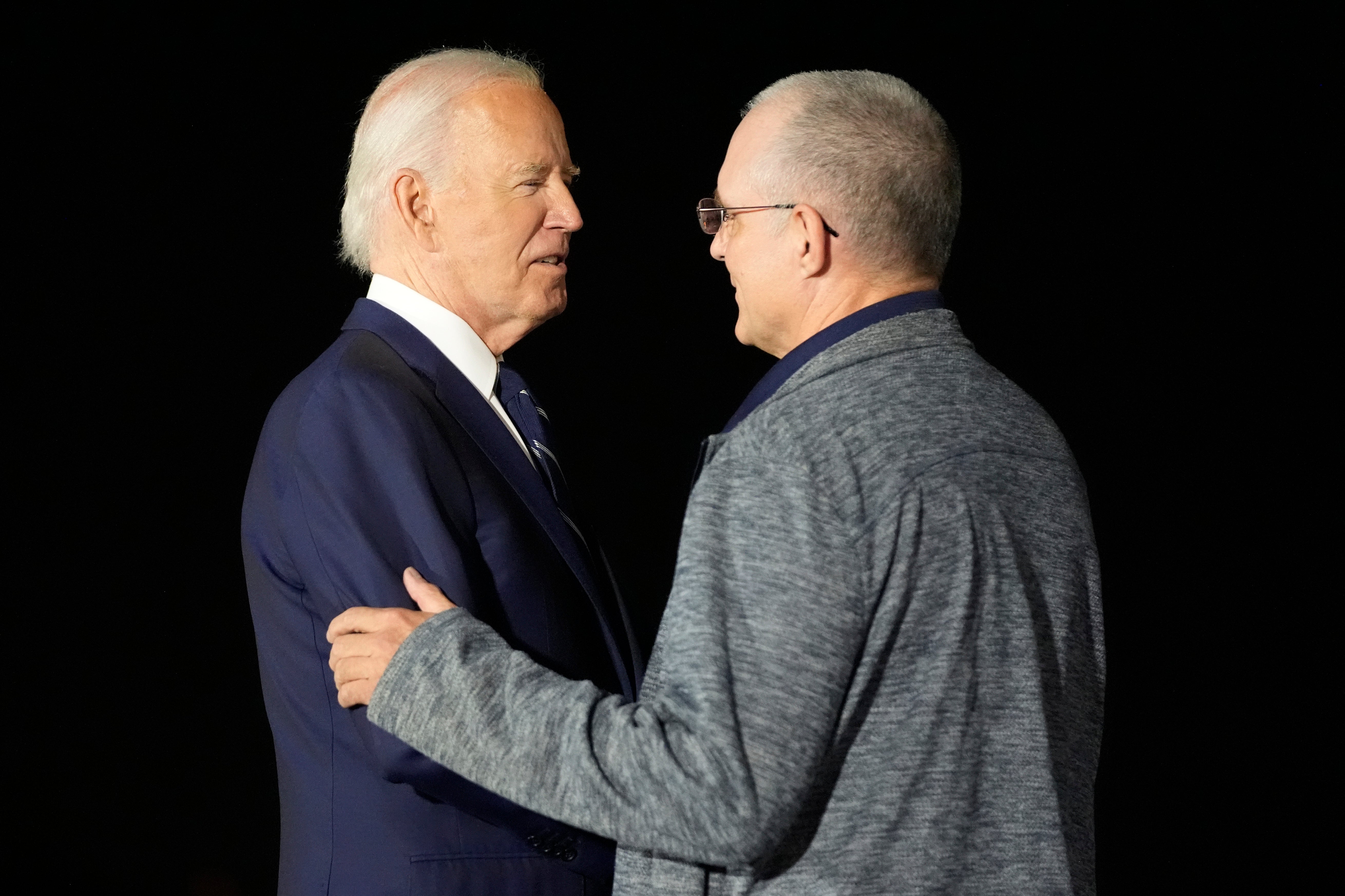 President Joe Biden, left, greets Paul Whelan at Andrews Air Force Base, Md., following his release as part of a 24-person prisoner swap