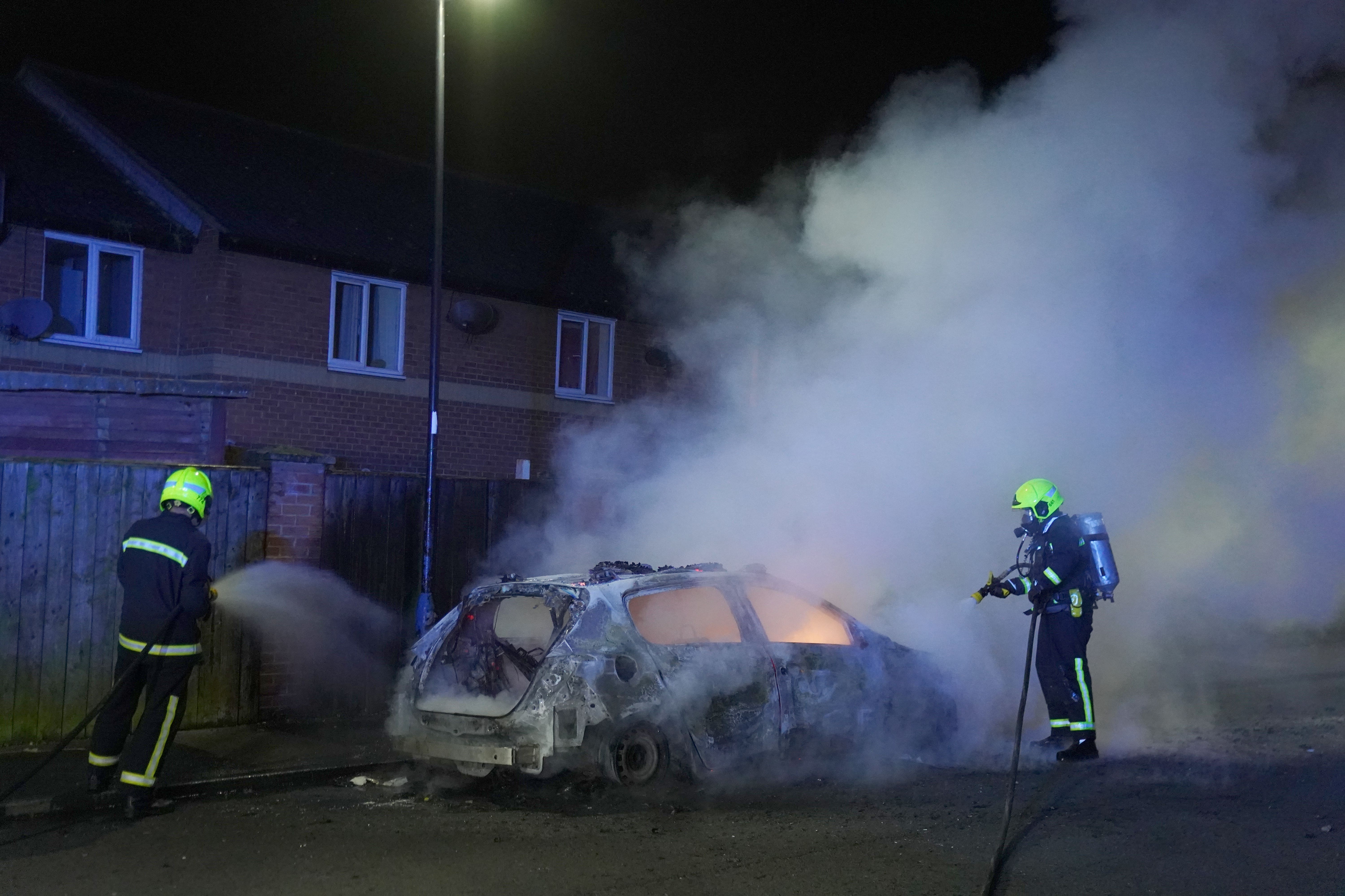 Firefighters work on a burning car in Hartlepool (Owen Humphreys/PA)