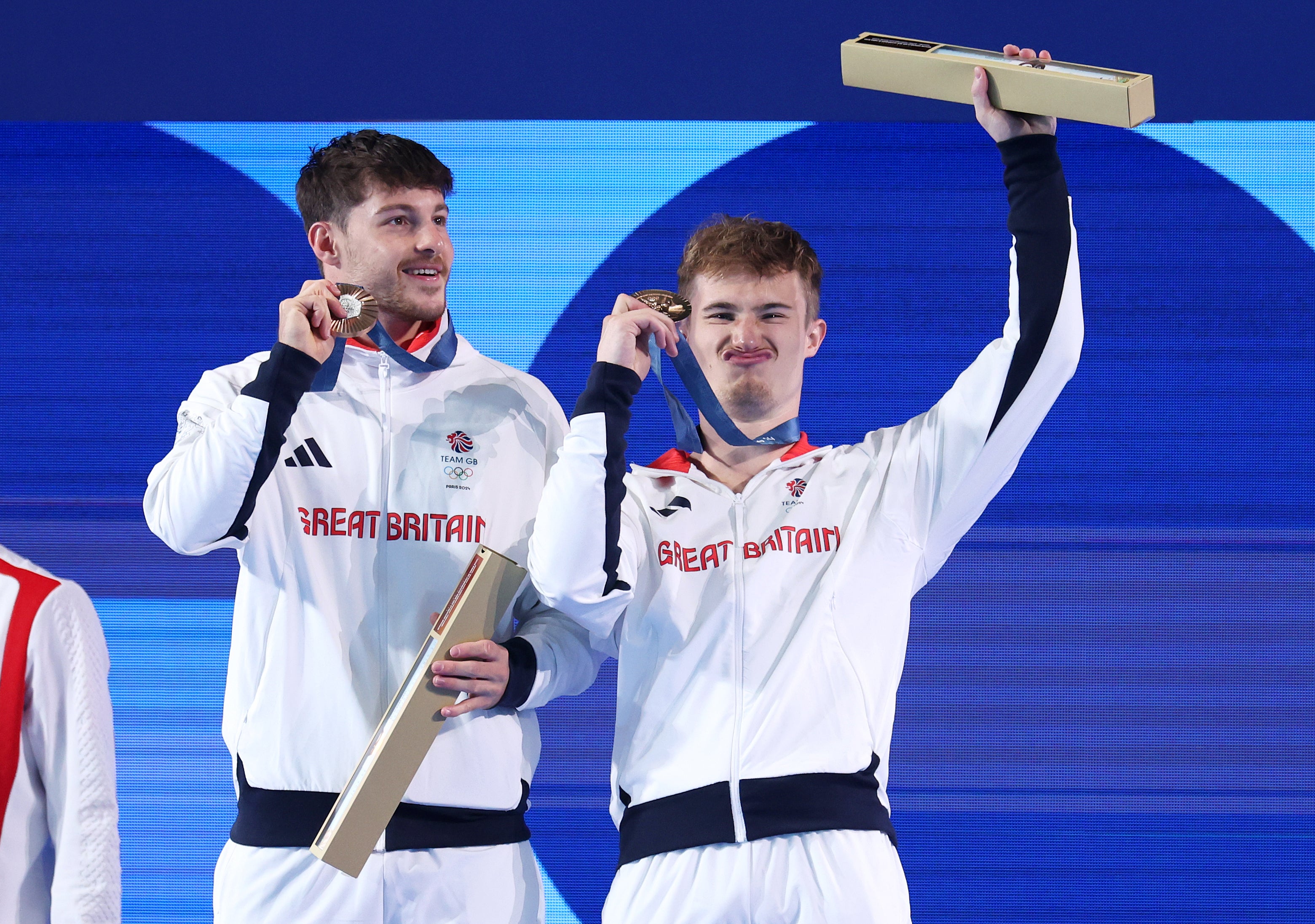 Harding and Laugher celebrate with their bronze medals