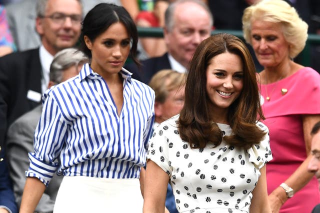 <p>Feuding sisters-in-law Meghan Markle at Kate Middleton at Wimbledon in 2018 </p>