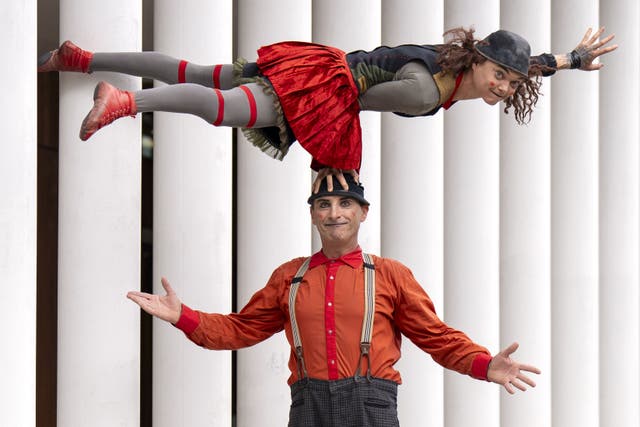 Fringe performers Camilla Pesi, top, and Simone Fassari from Compagnia Baccala perform their act (Jane Barlow/PA)