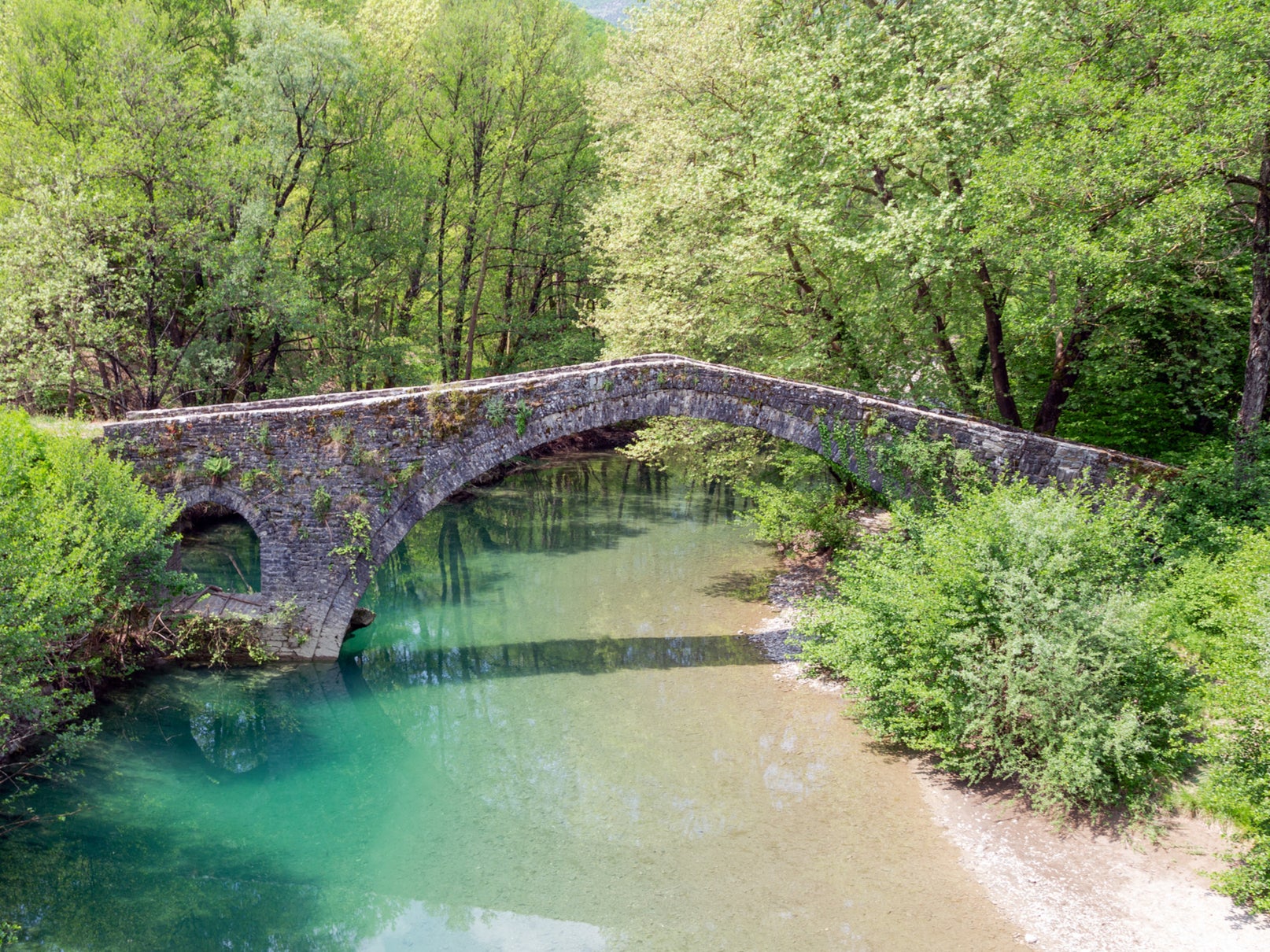  There’s no shortage of stone paths across waterways in Zagori