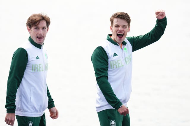 Ireland’s Fintan McCarthy (left) and Paul O’Donovan celebrate winning gold in the lightweight men’s double sculls at the Paris Olympics (John Walton/PA)