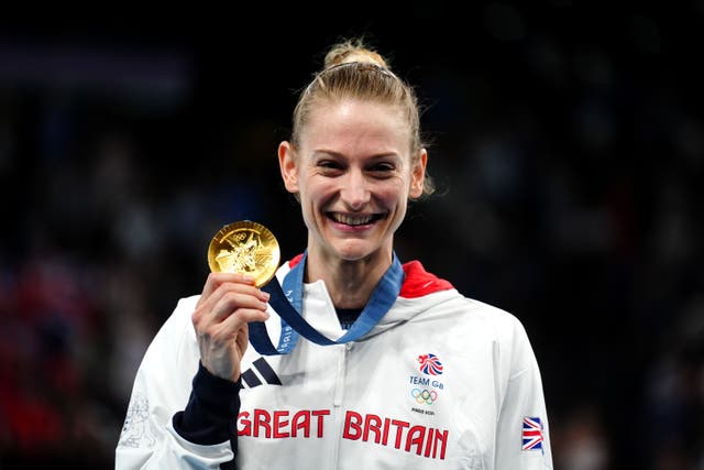 Bryony Page smiles holding her gold medal (Mike Egerton/PA)