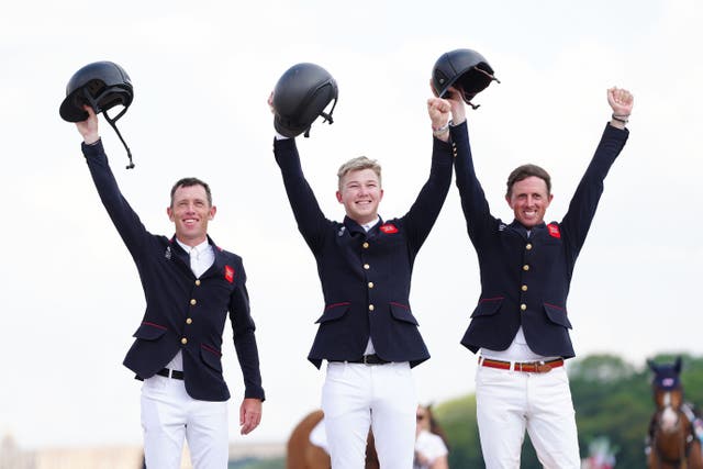 Scott Brash, Harry Charles and Ben Maher (left to right) celebrate winning gold in the jumping team final (David Davies/PA).