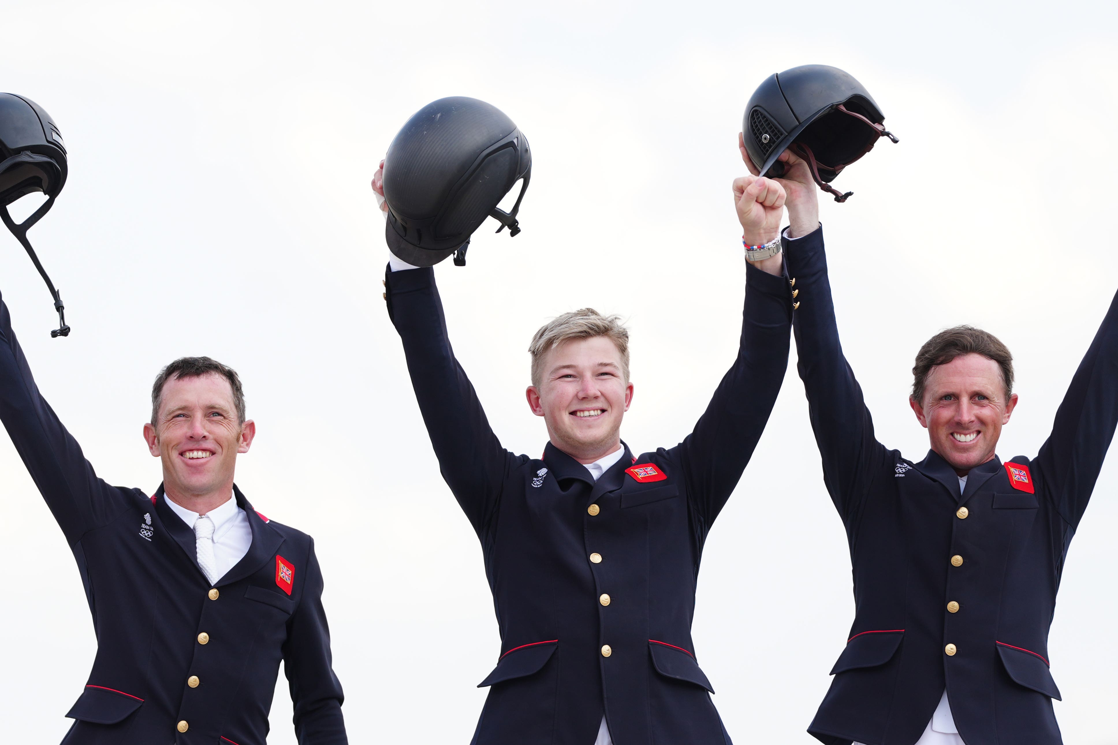 Harry Charles, centre, won gold with Scott Brash, left, and Ben Maher (David Davies/PA)