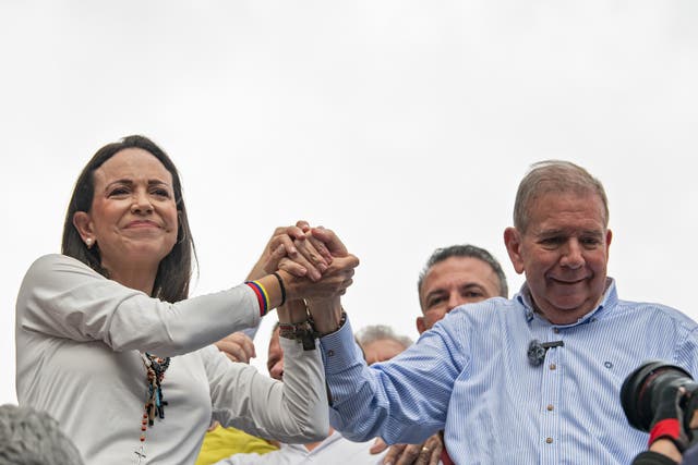 <p>Opposition leader Maria Corina Machado and opposition presidential candidate Edmundo Gonzalez join hands during a protest against the result of the presidential election on July 30, 2024 </p>