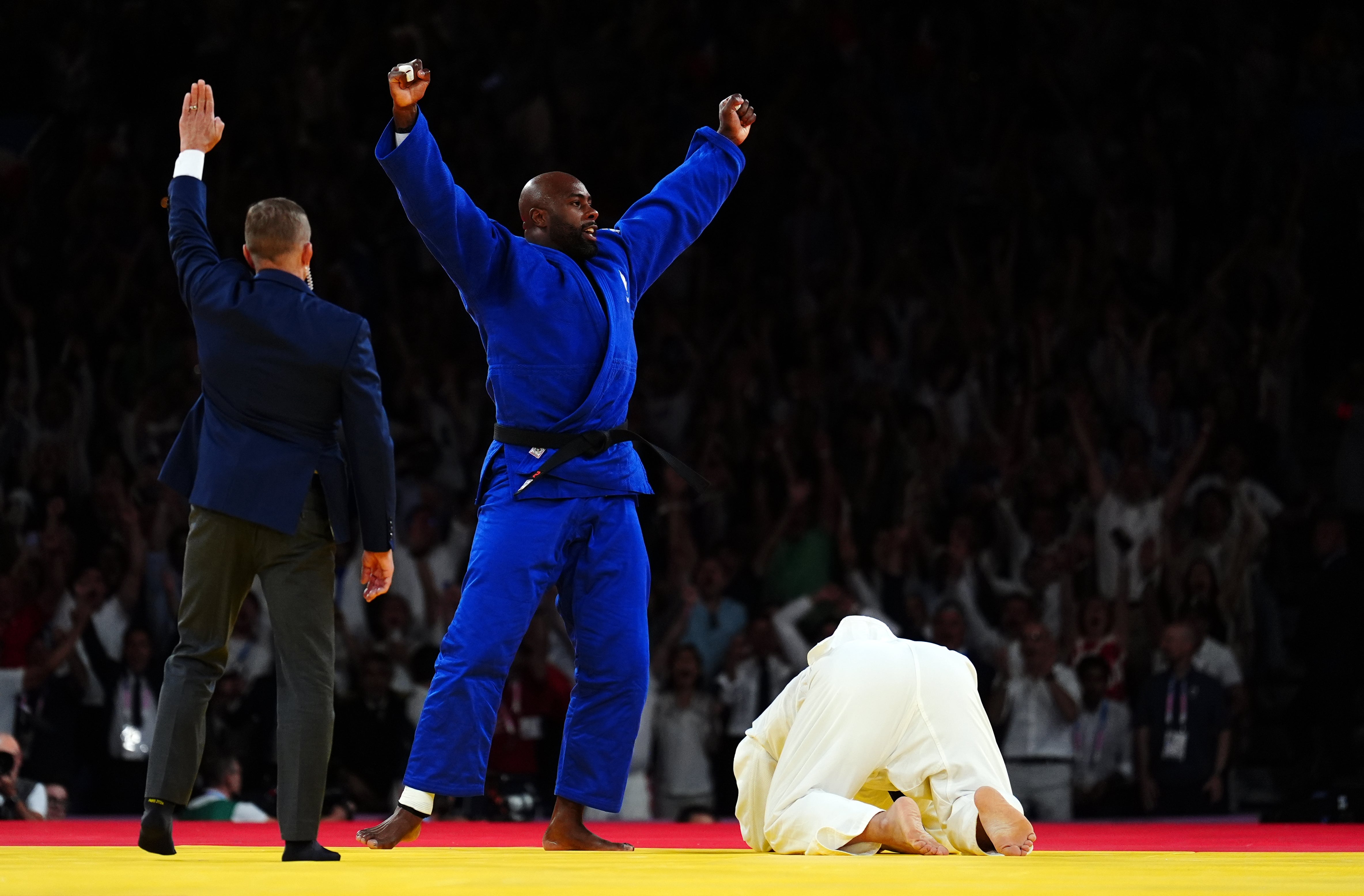 France’s judoka Teddy Riner celebrates victory over South Korea’s Kim Minjong (Mike Egerton/PA)