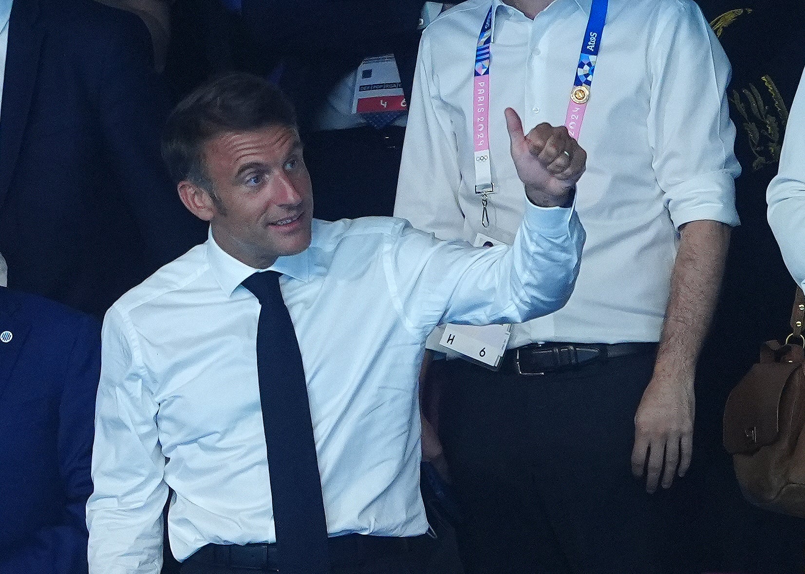 France President Emmanuel Macron, pictured, cheered Leon Marchand to victory on Friday night (Peter Byrne/PA)