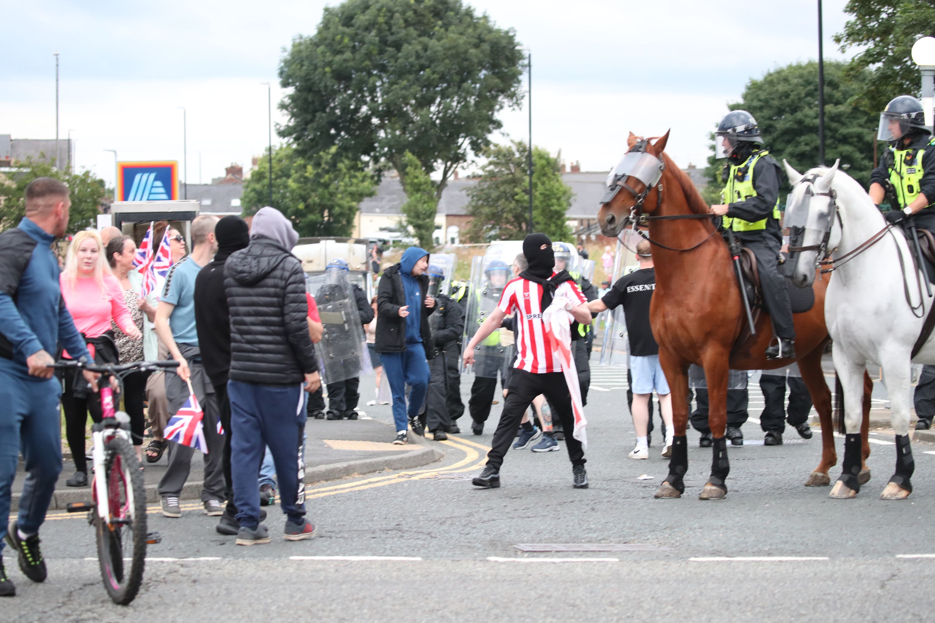 Mounted police followed the march, along with officers in vans who battled their way through traffic to keep up (PA)