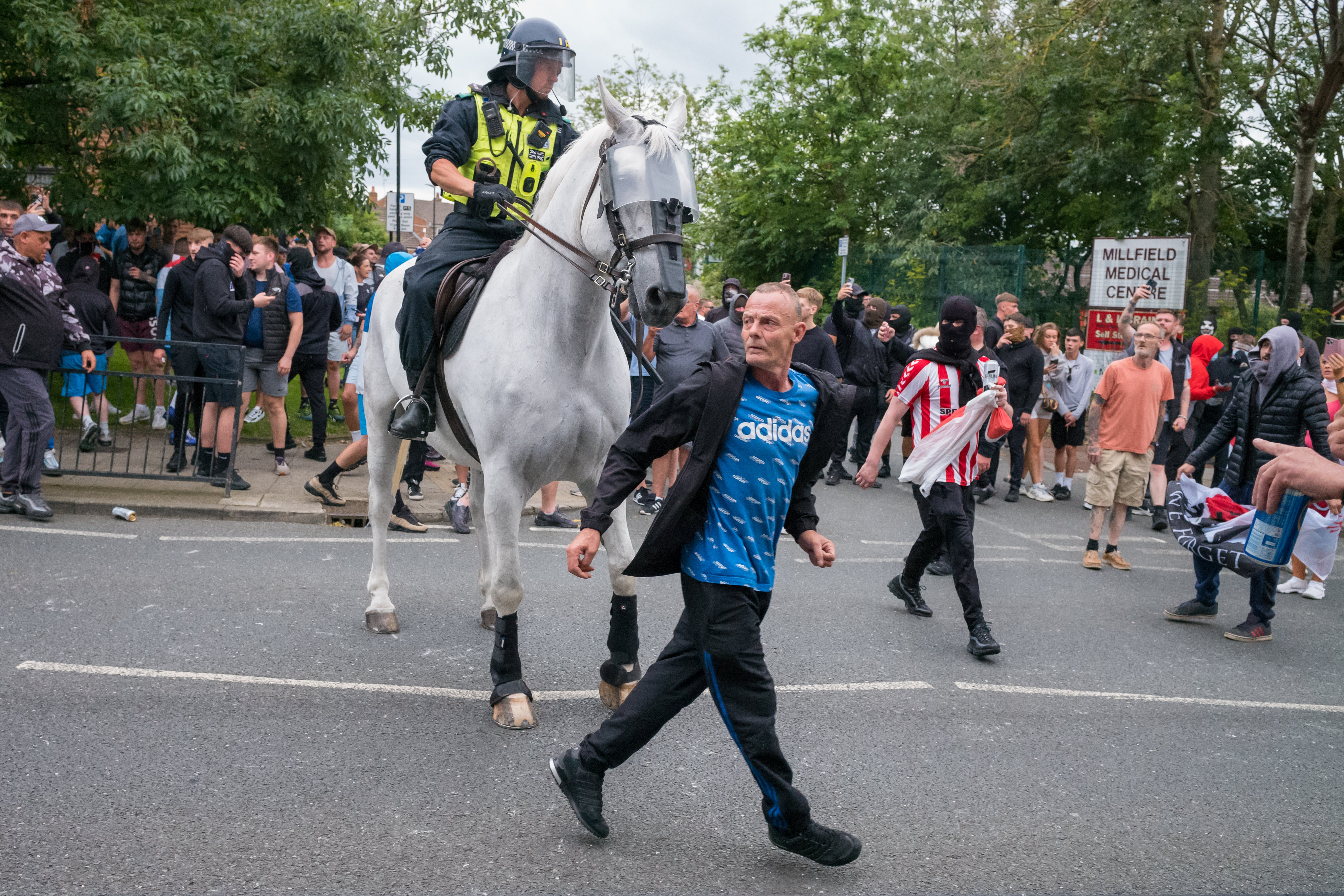 Mounted police deal with demonstrators as far-right activists hold an Enough is Enough protest in Sunderland