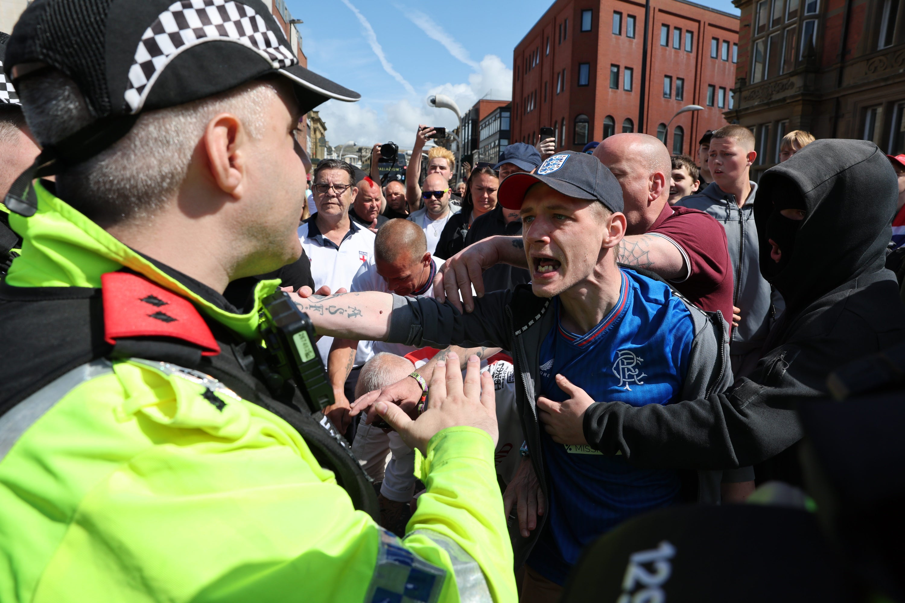 People demonstrate in Blackpool, following the stabbing attacks on Monday in Southport