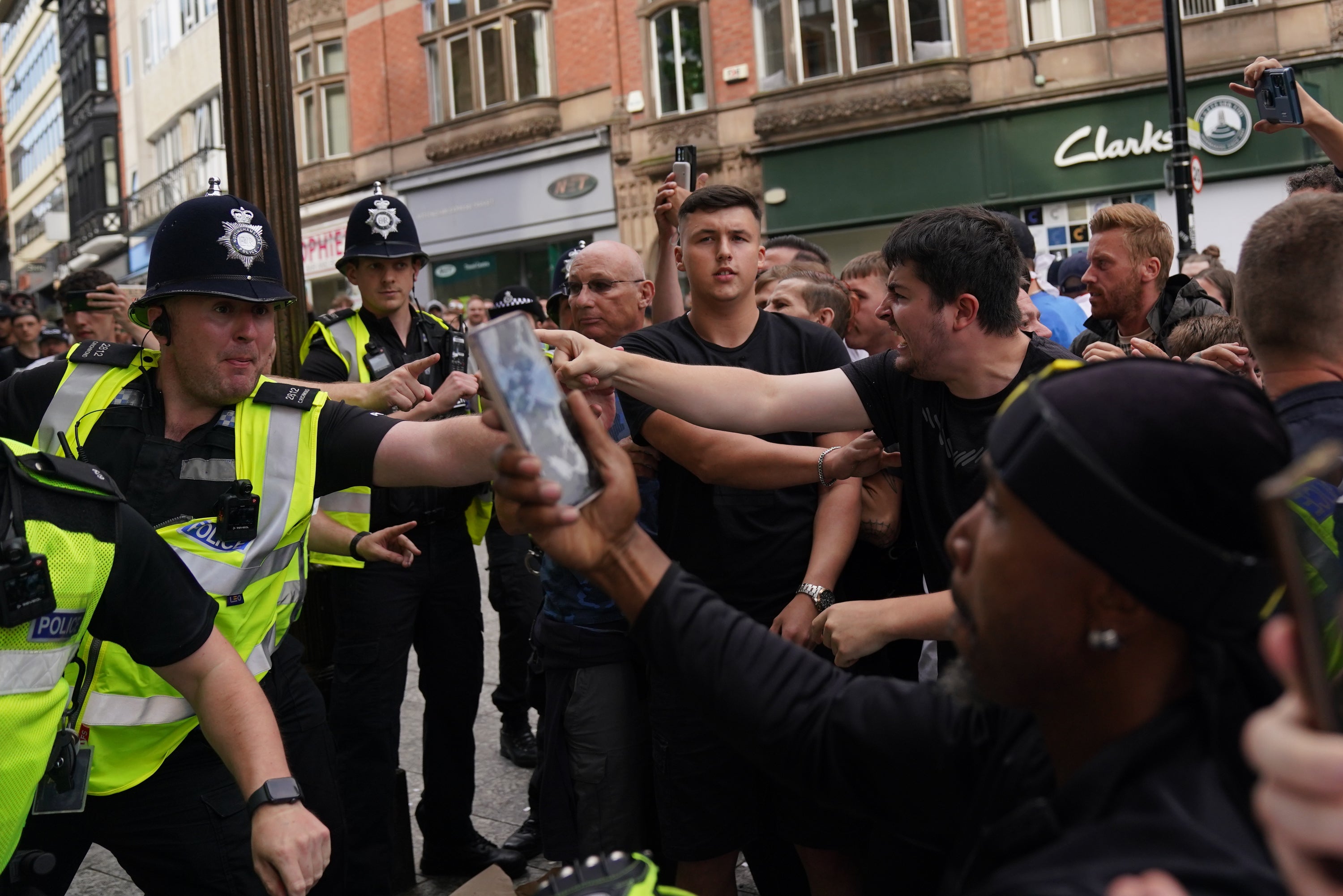 Police face protesters in Nottingham (Jacob King/PA)